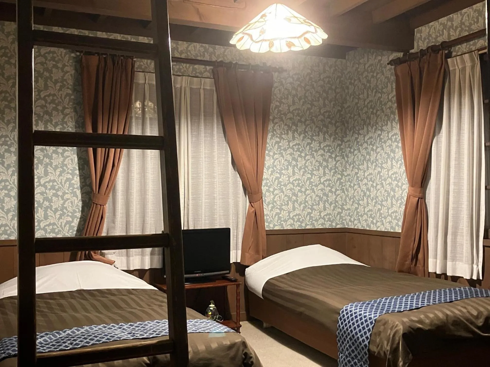 Photo of the whole room, Bed in Pension Marionette