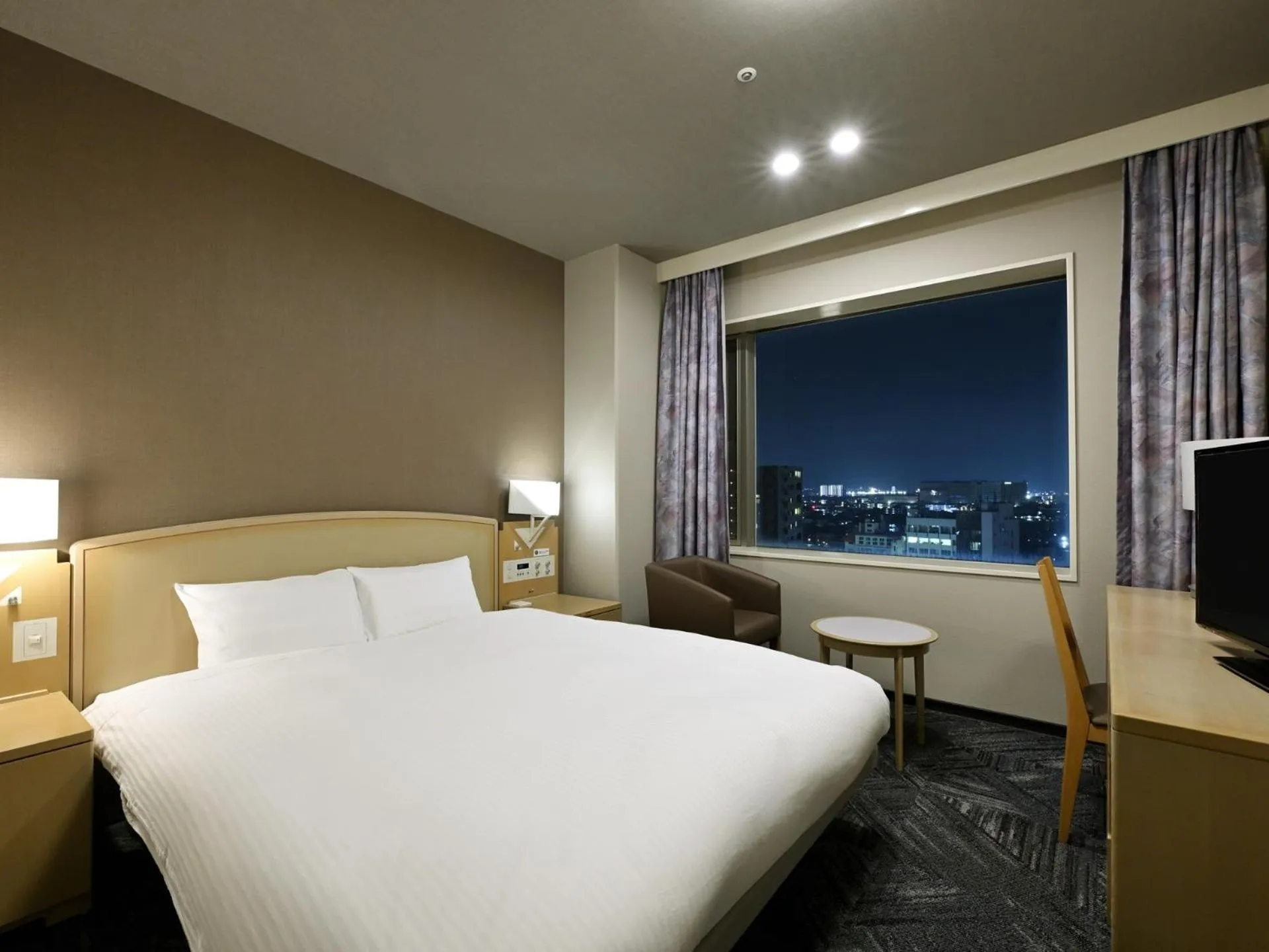 Bed in Tokushima Grandvrio Hotel
