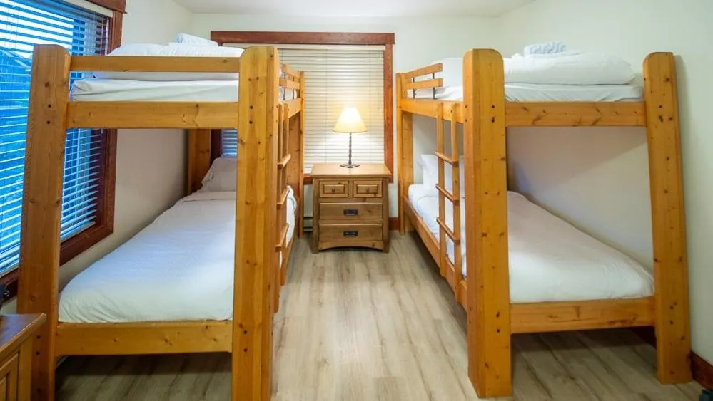 Bed in Timberline Lodges by Fernie Lodging Co