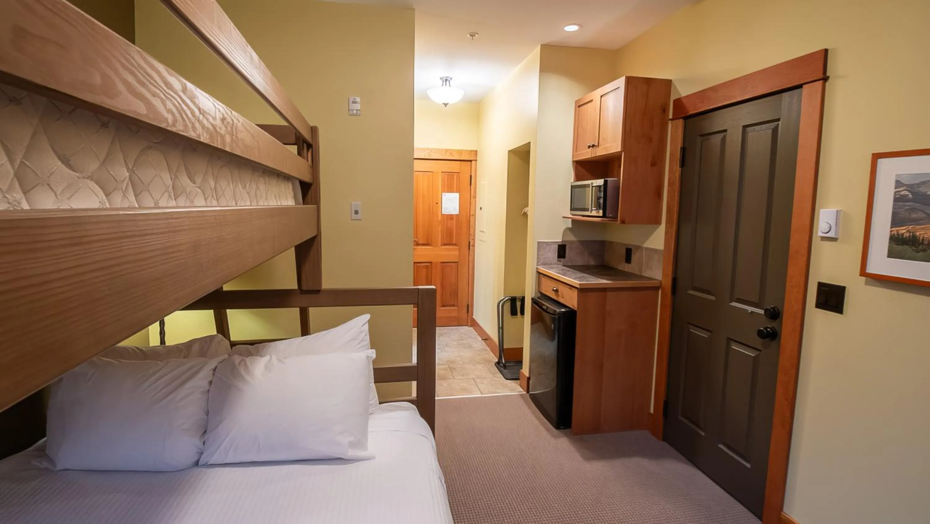 Bed in Timberline Lodges by Fernie Lodging Co