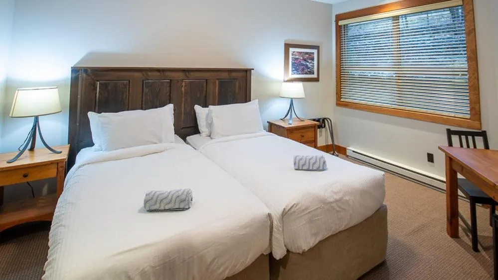 Bed in Timberline Lodges by Fernie Lodging Co