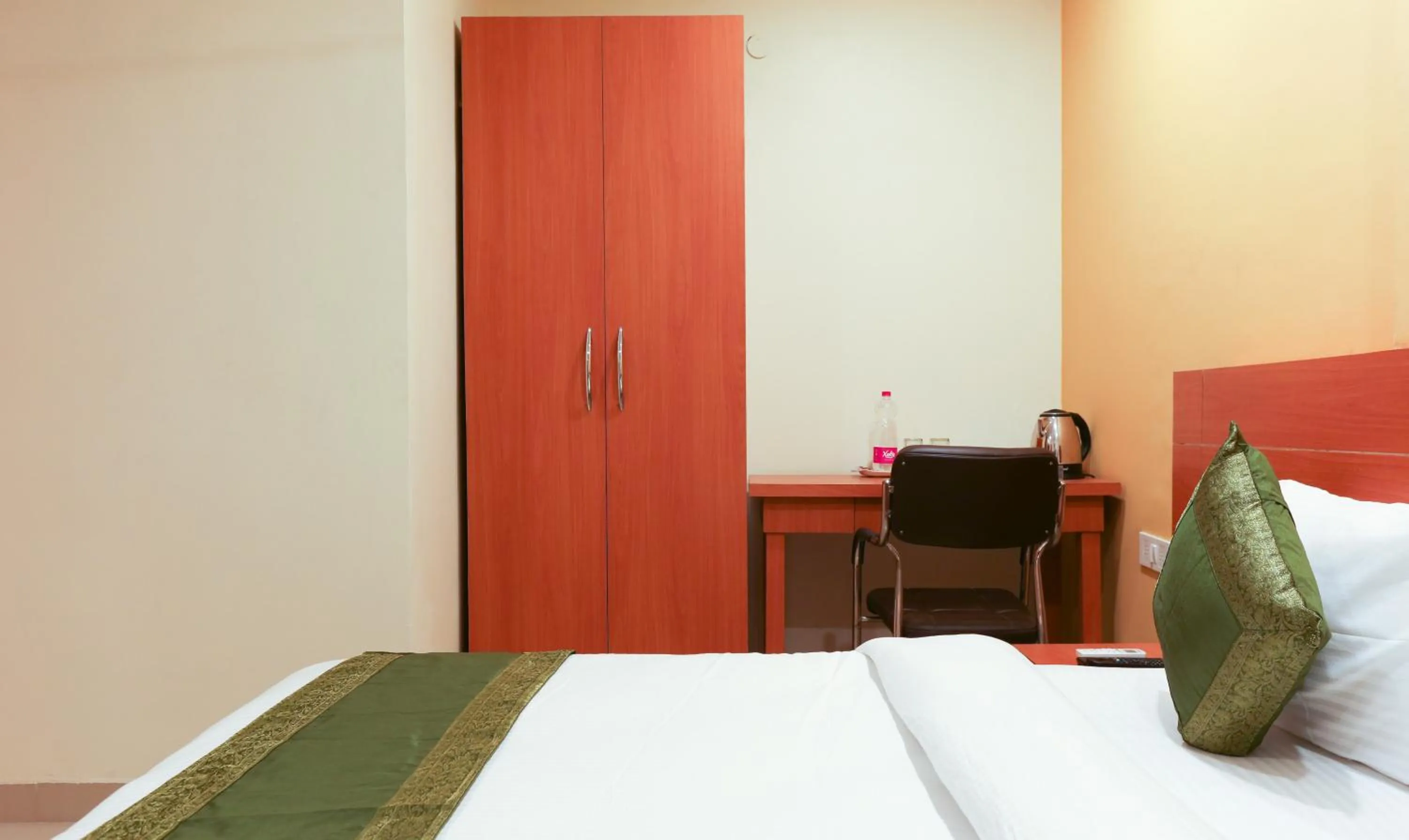 wardrobe, Bed in Hotel TMS Residency