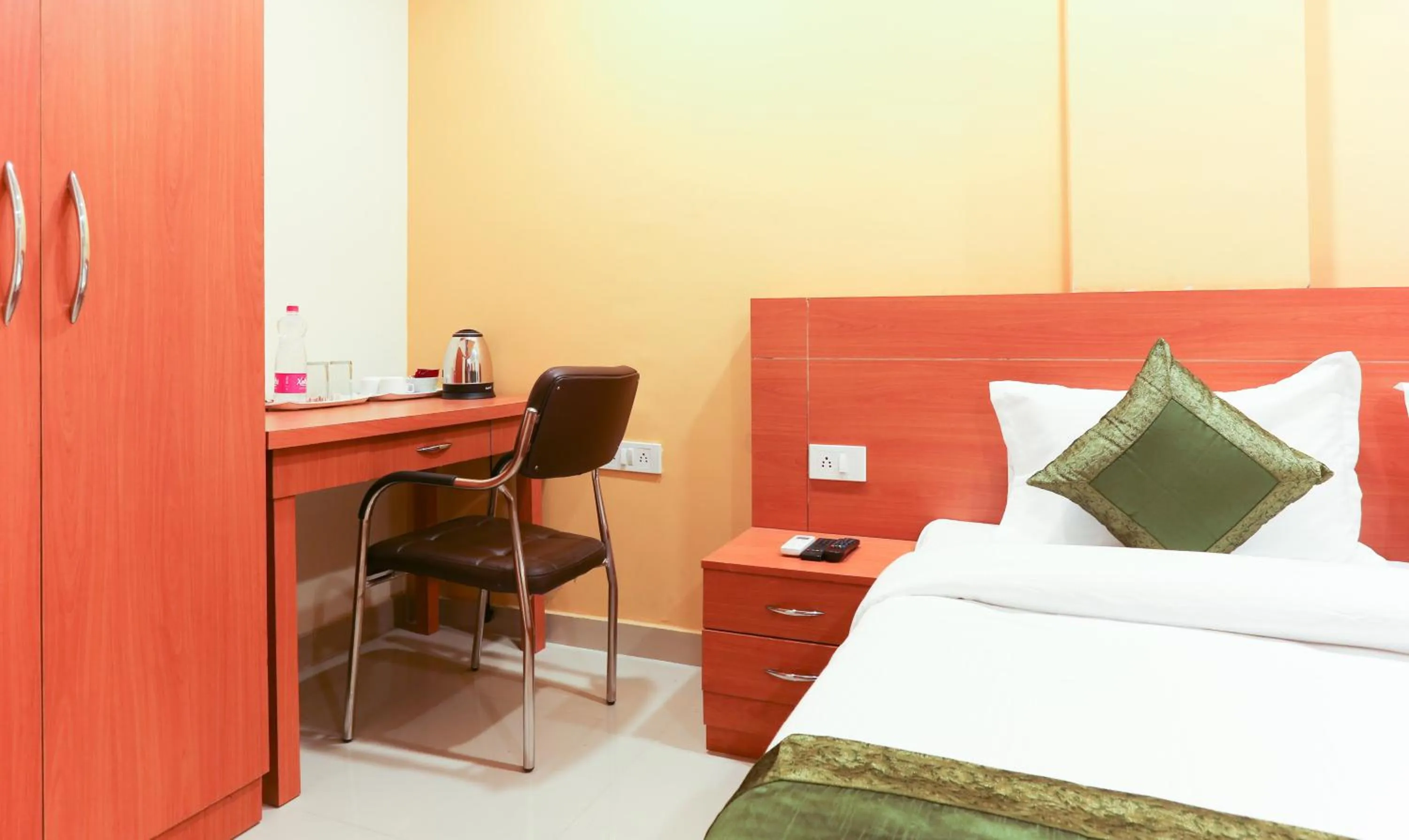 wardrobe, Bed in Hotel TMS Residency