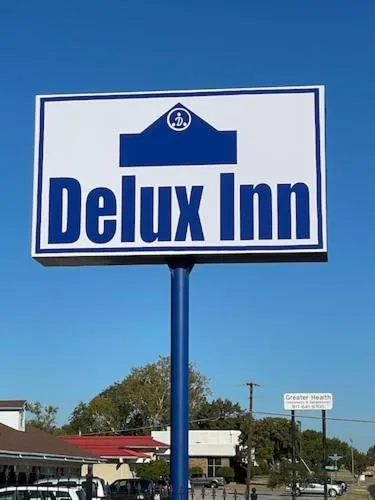 Property logo or sign in Delux Inn Cleburne