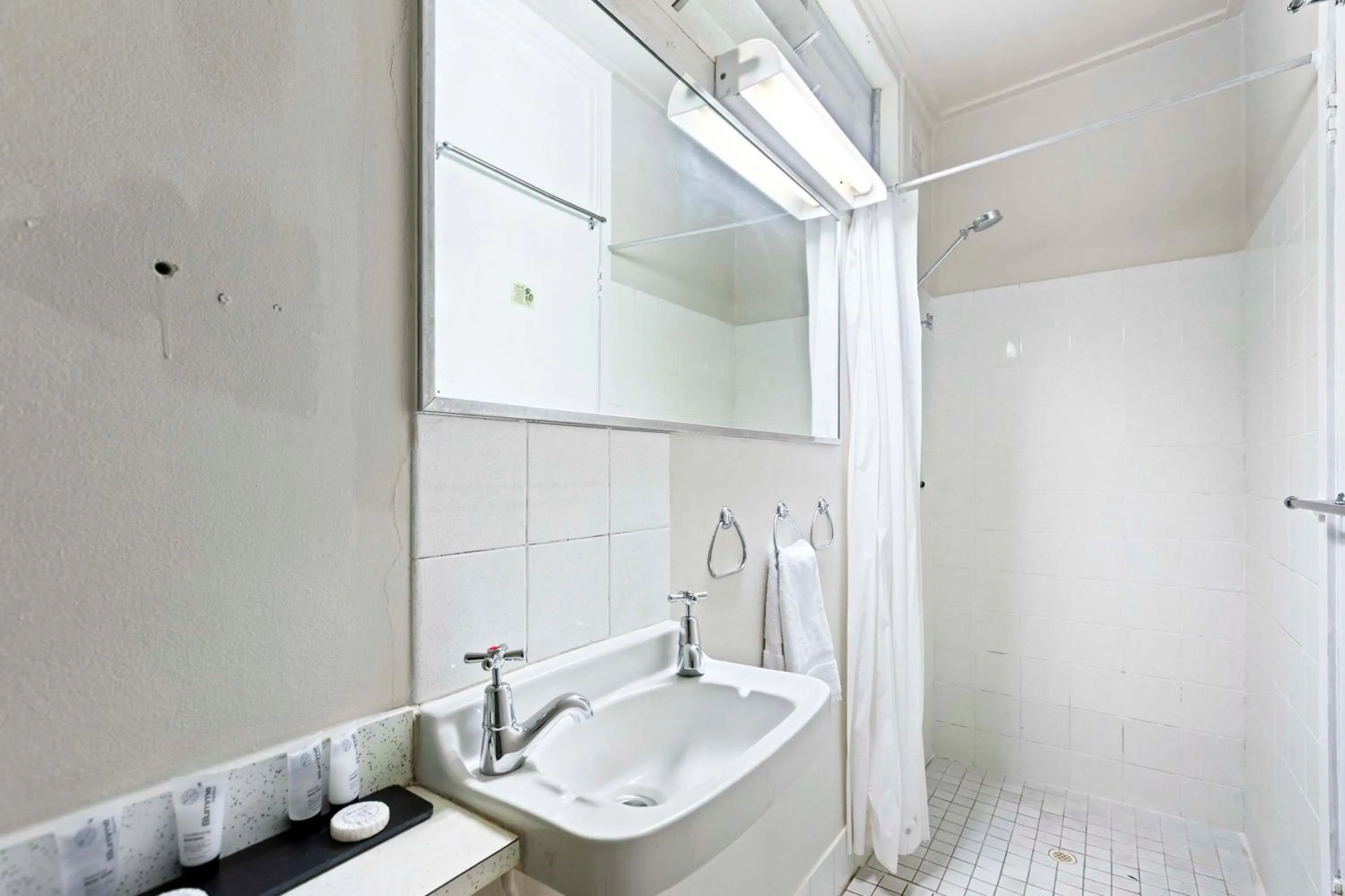 Bathroom in Arkana Motel Maryborough, SureStay Collection by Best Western