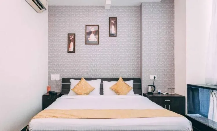 Bed in Hotel Suraj Palace