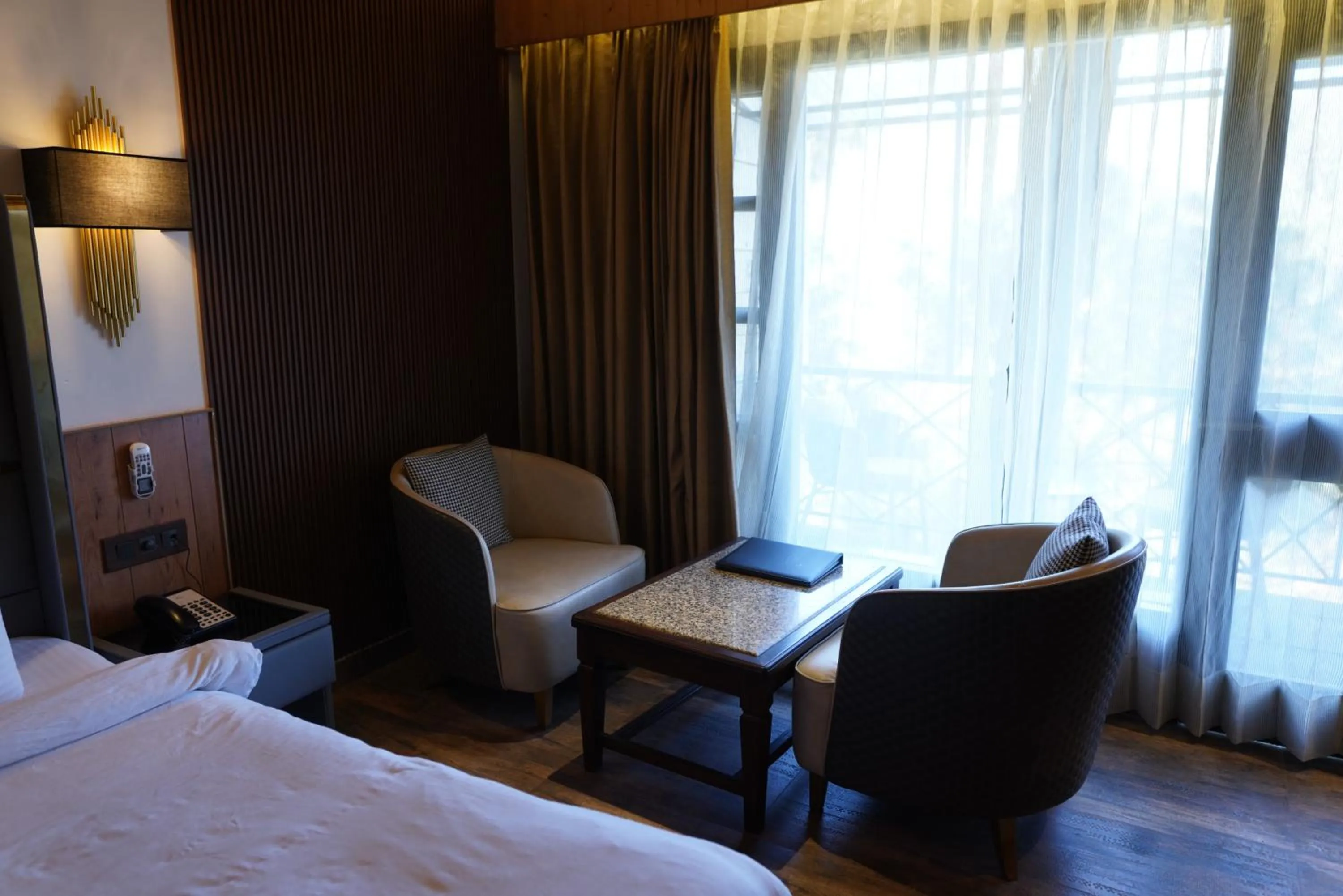 Seating area, Bed in Kasauli Hills Resort