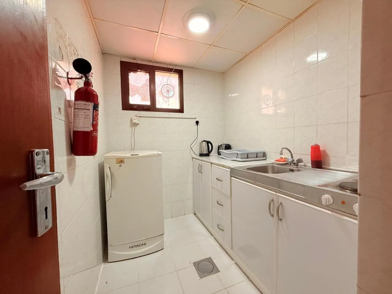 Kitchen or kitchenette in Al Buhaira Hotel Apartment