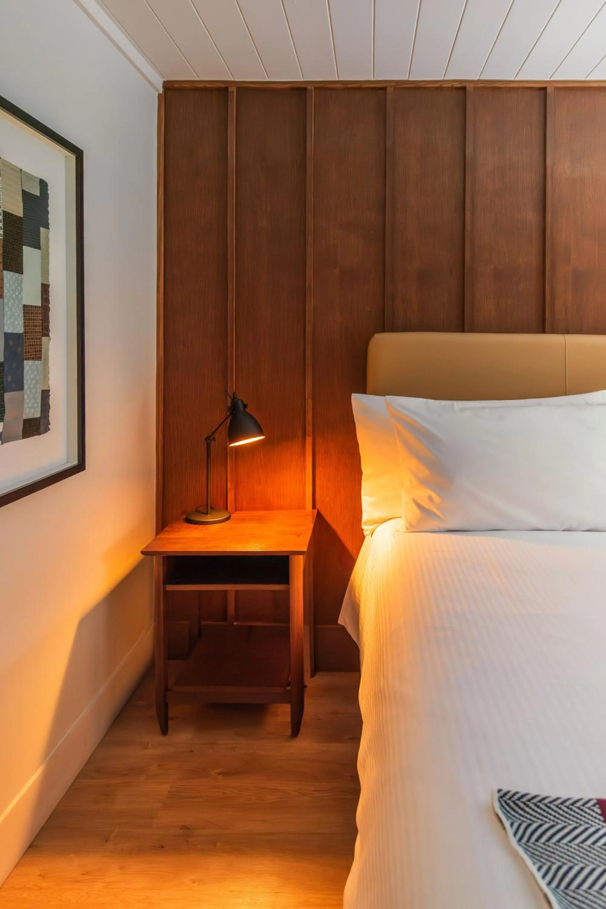 Bed in Historic Rocky Waters Inn, A Small Luxury Hotel