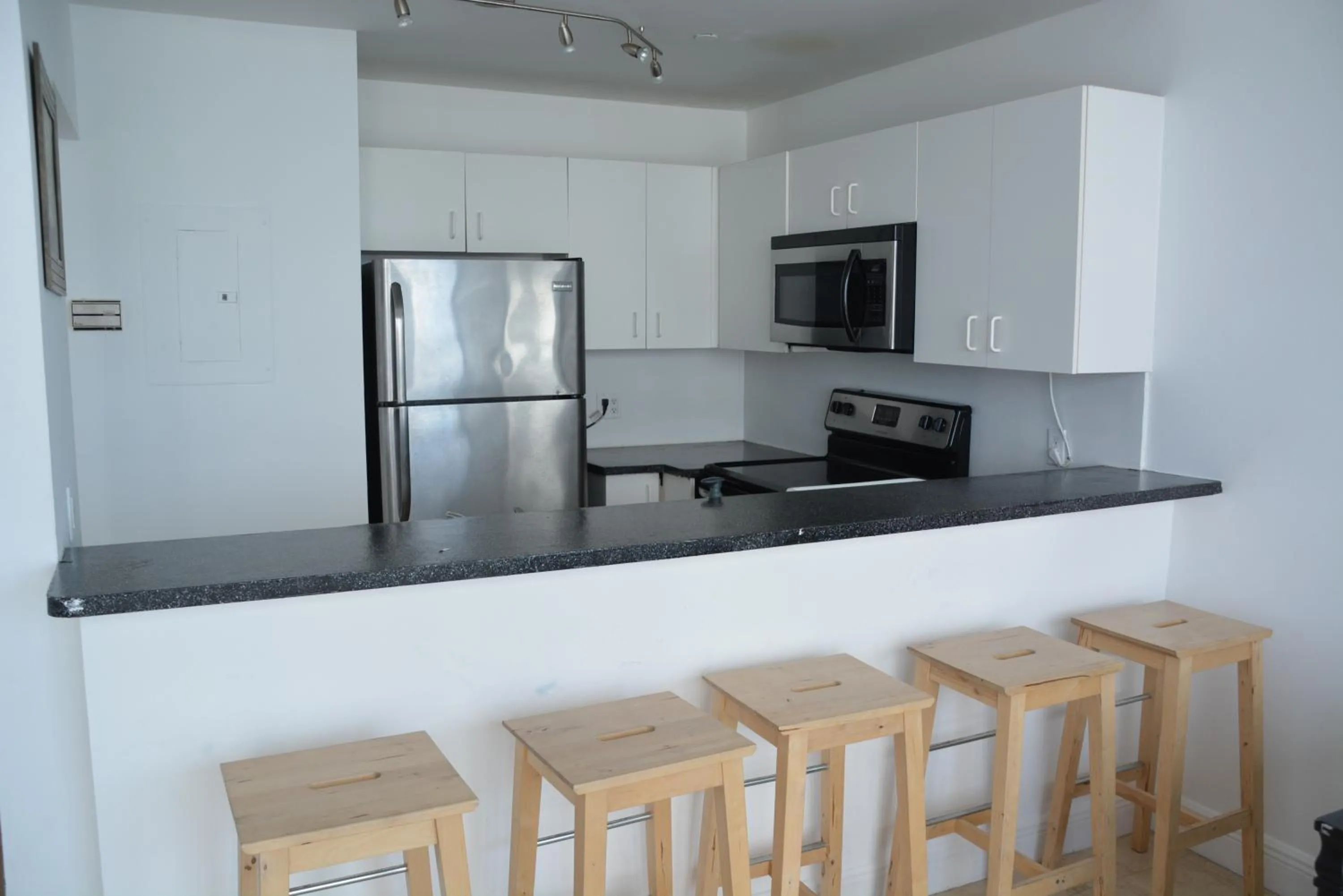 Kitchen or kitchenette in New Point Miami Beach Apartments