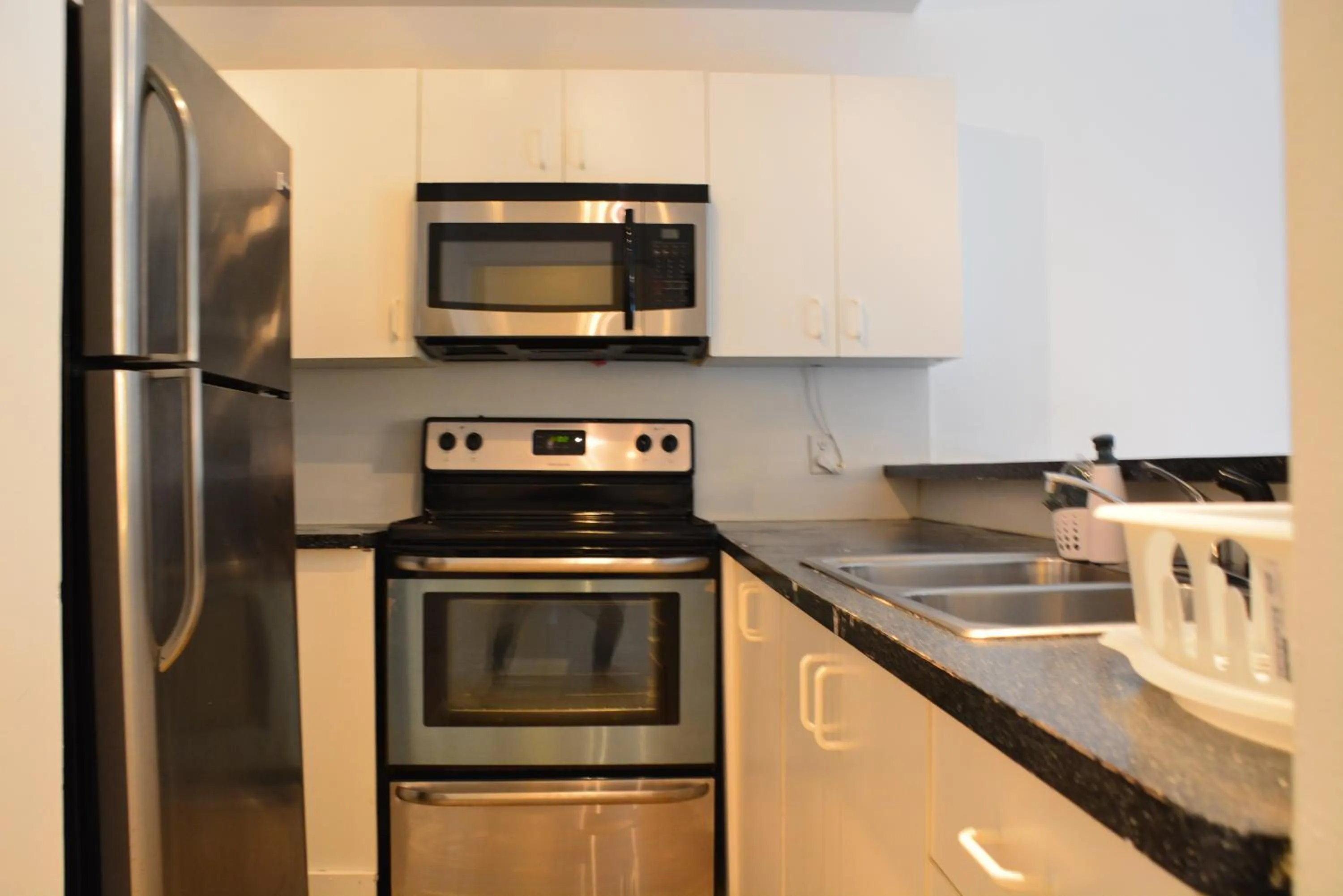 Kitchen or kitchenette in New Point Miami Beach Apartments