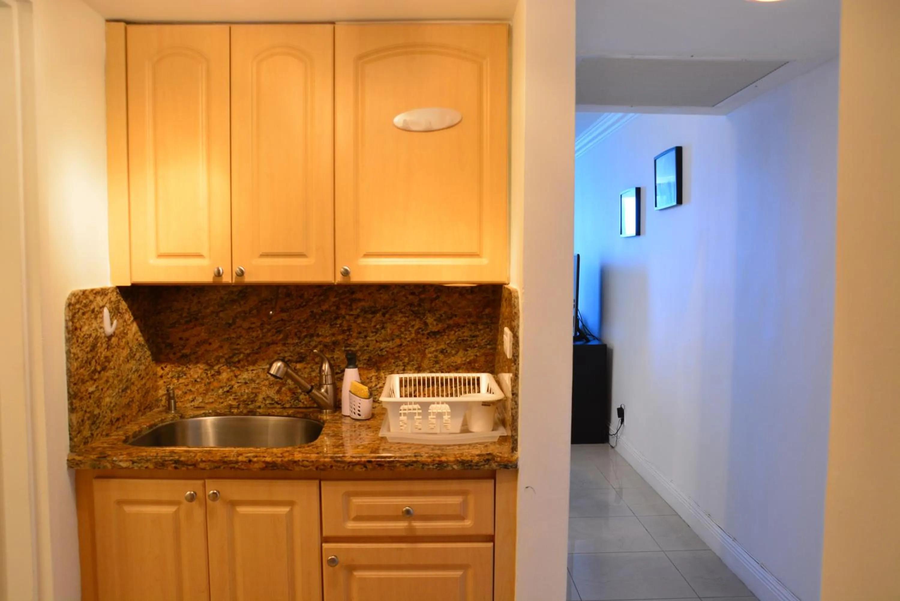 Kitchen or kitchenette in New Point Miami Beach Apartments