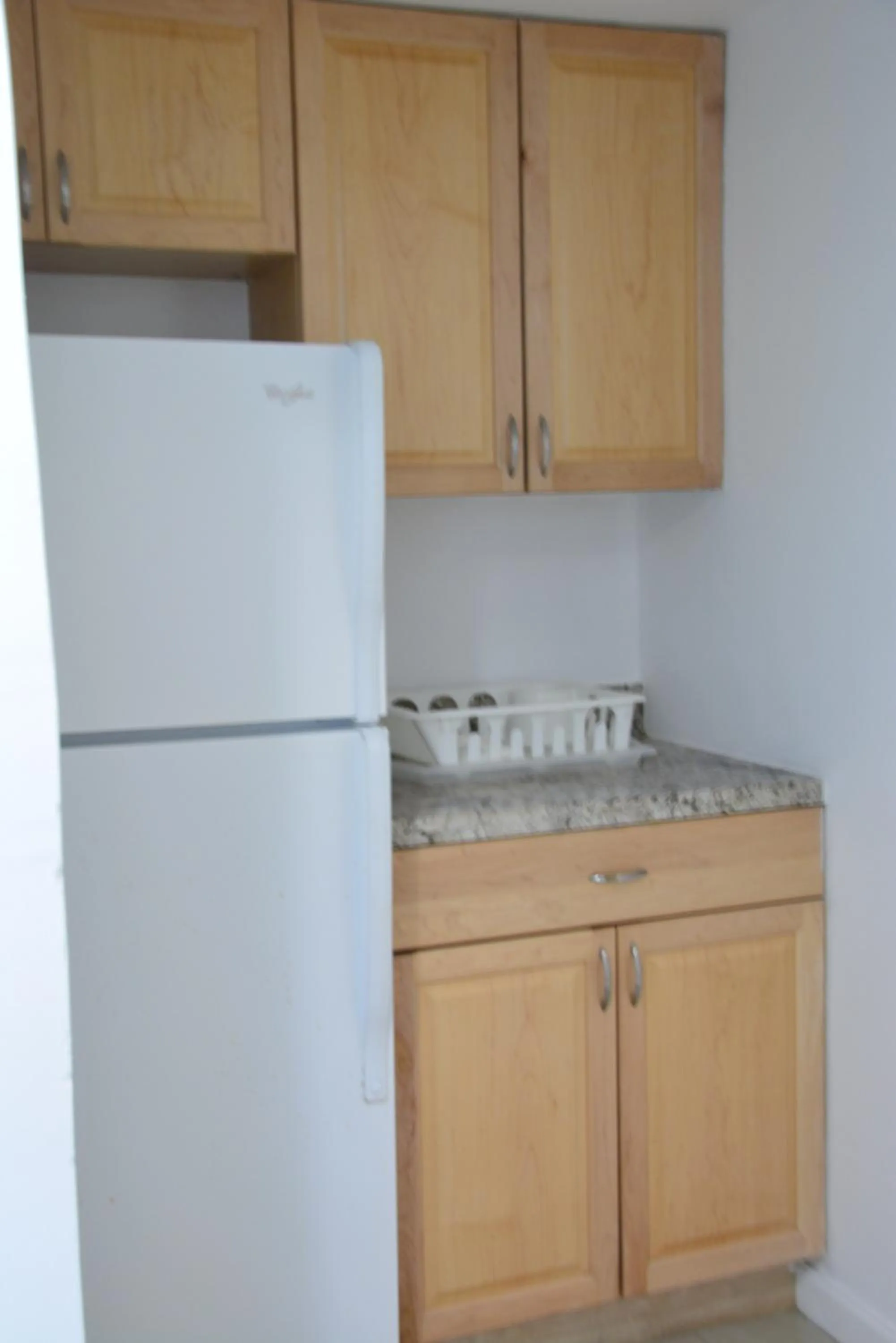 Kitchen or kitchenette in New Point Miami Beach Apartments