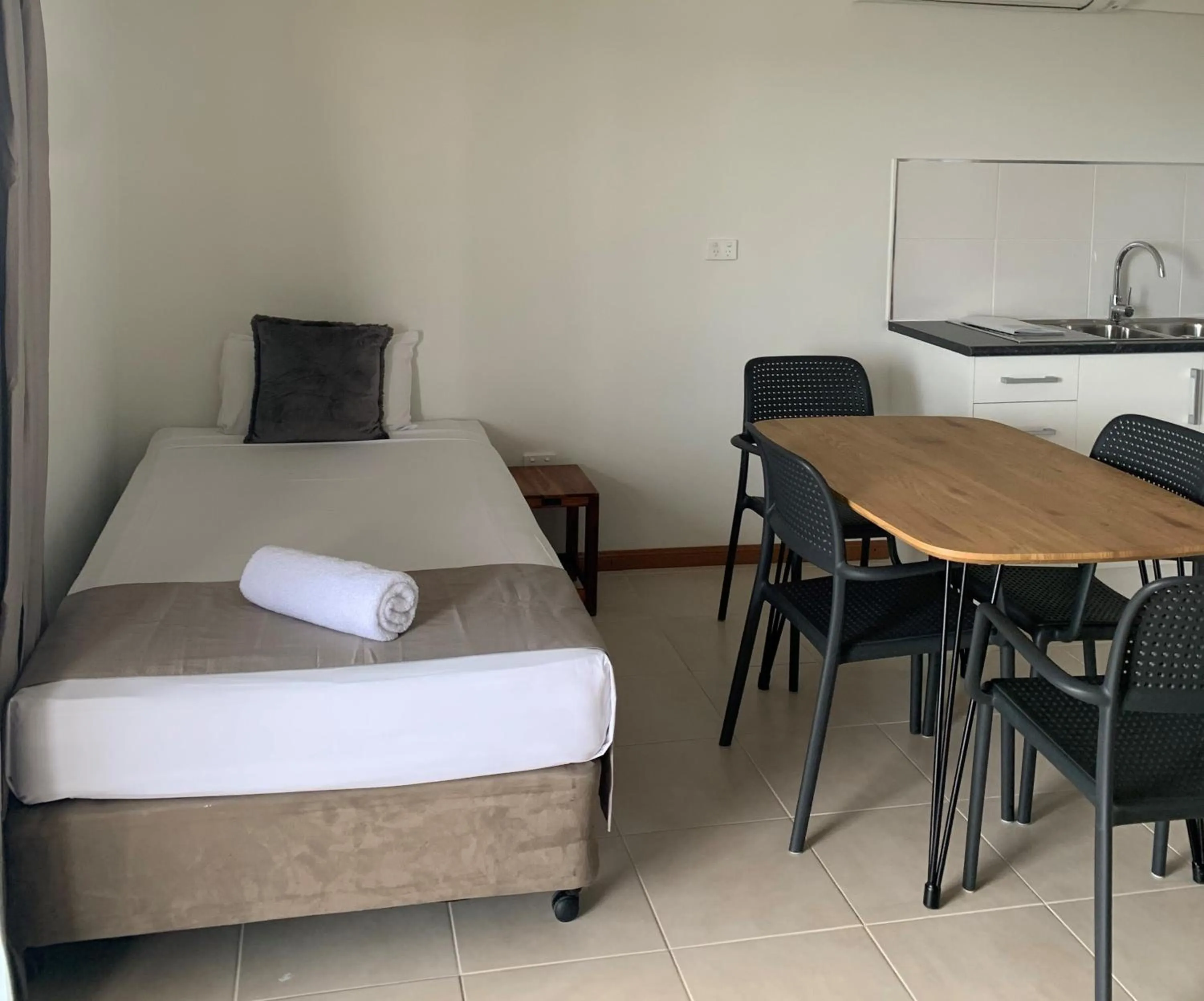 Bed in Airlie Beach Apartments