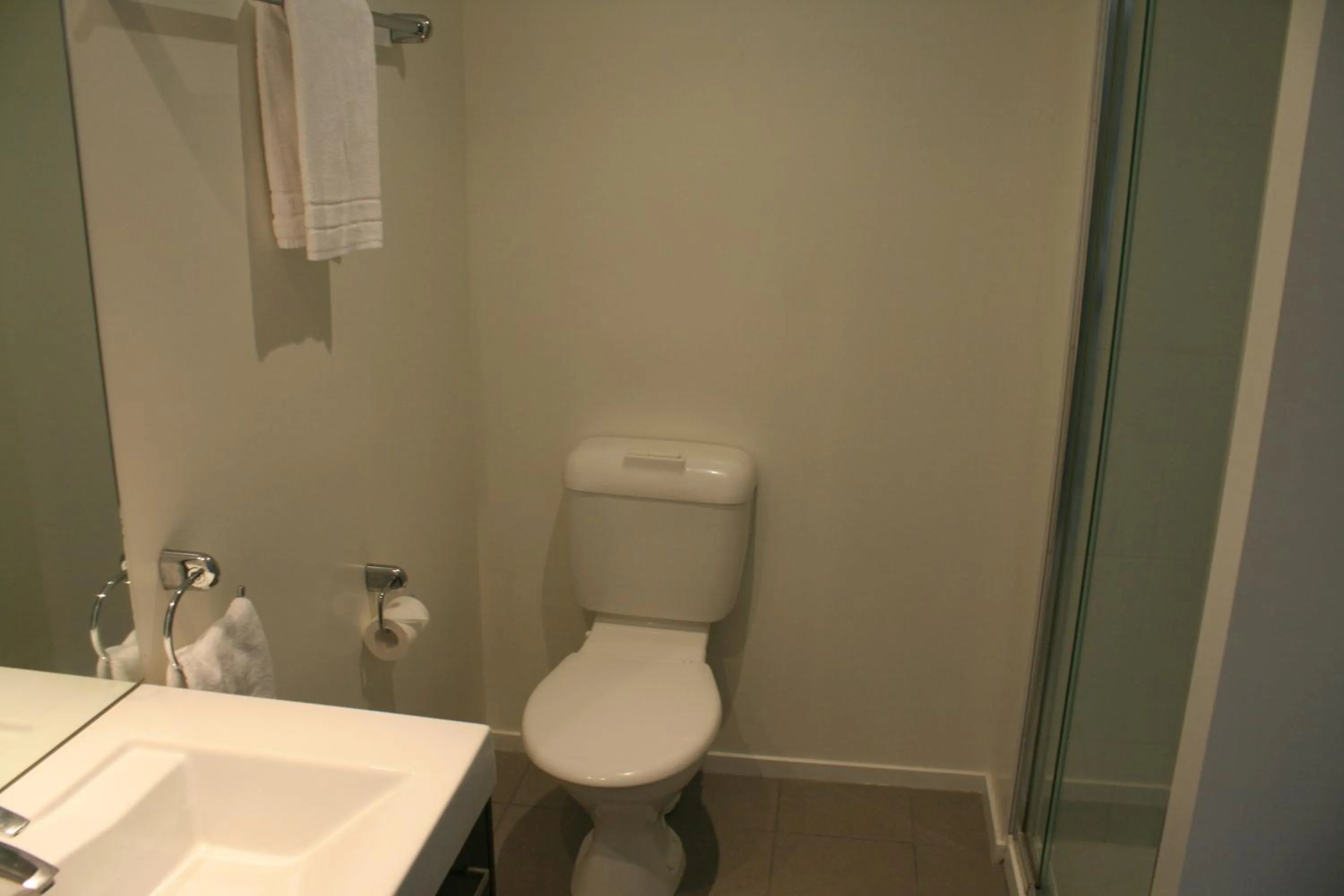 Toilet in Atlas Suites and Apartments