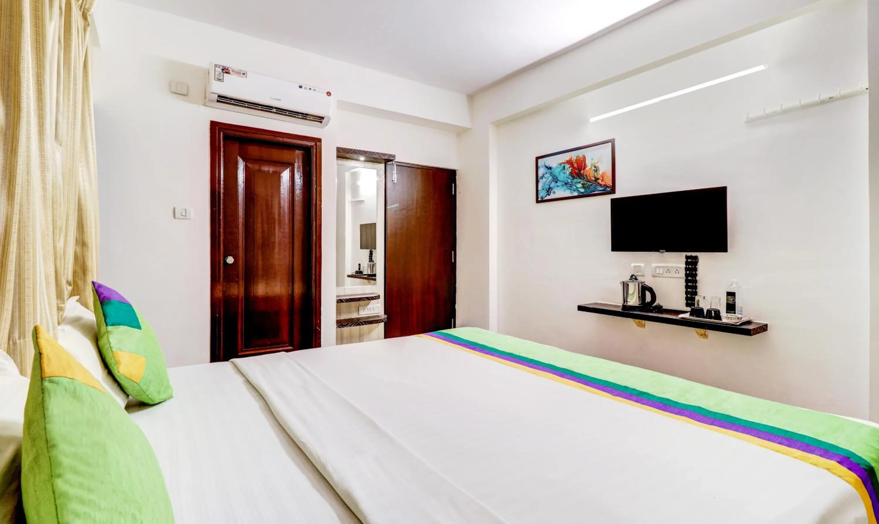 Bedroom, Bed in Treebo Saga Apartment