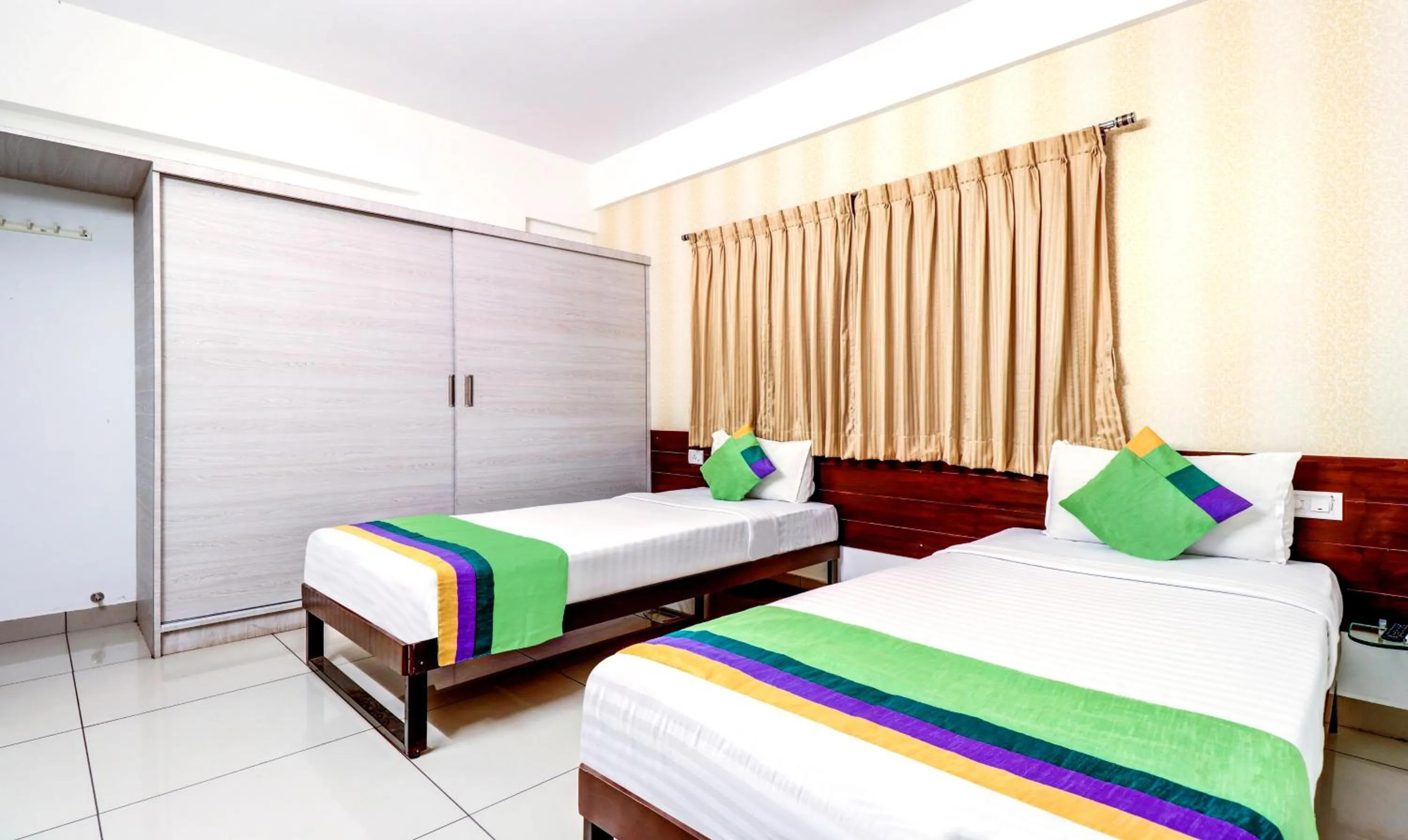 Bedroom, Bed in Treebo Saga Apartment