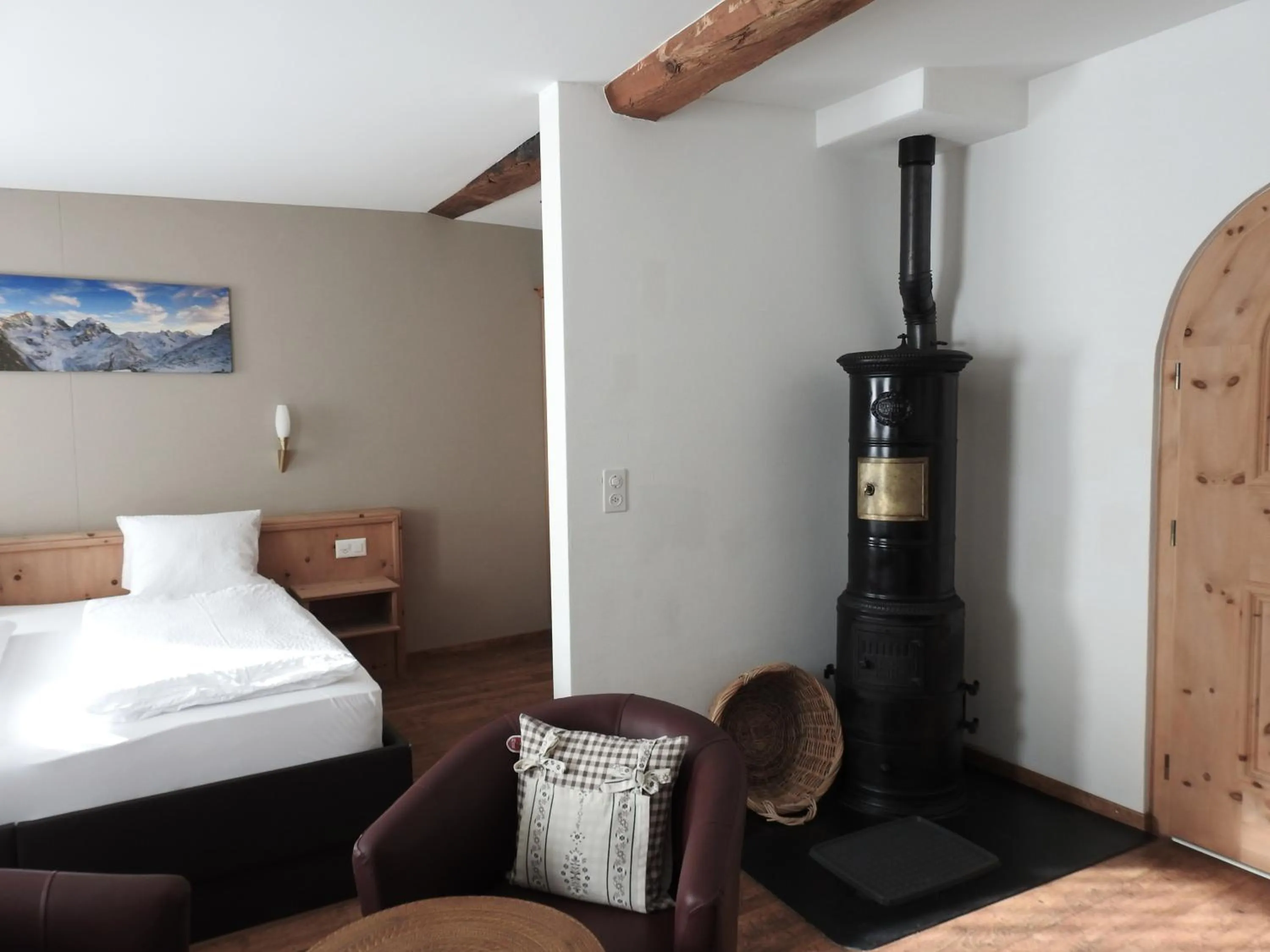 fireplace, Bed in Hotel Spöl Restaurant