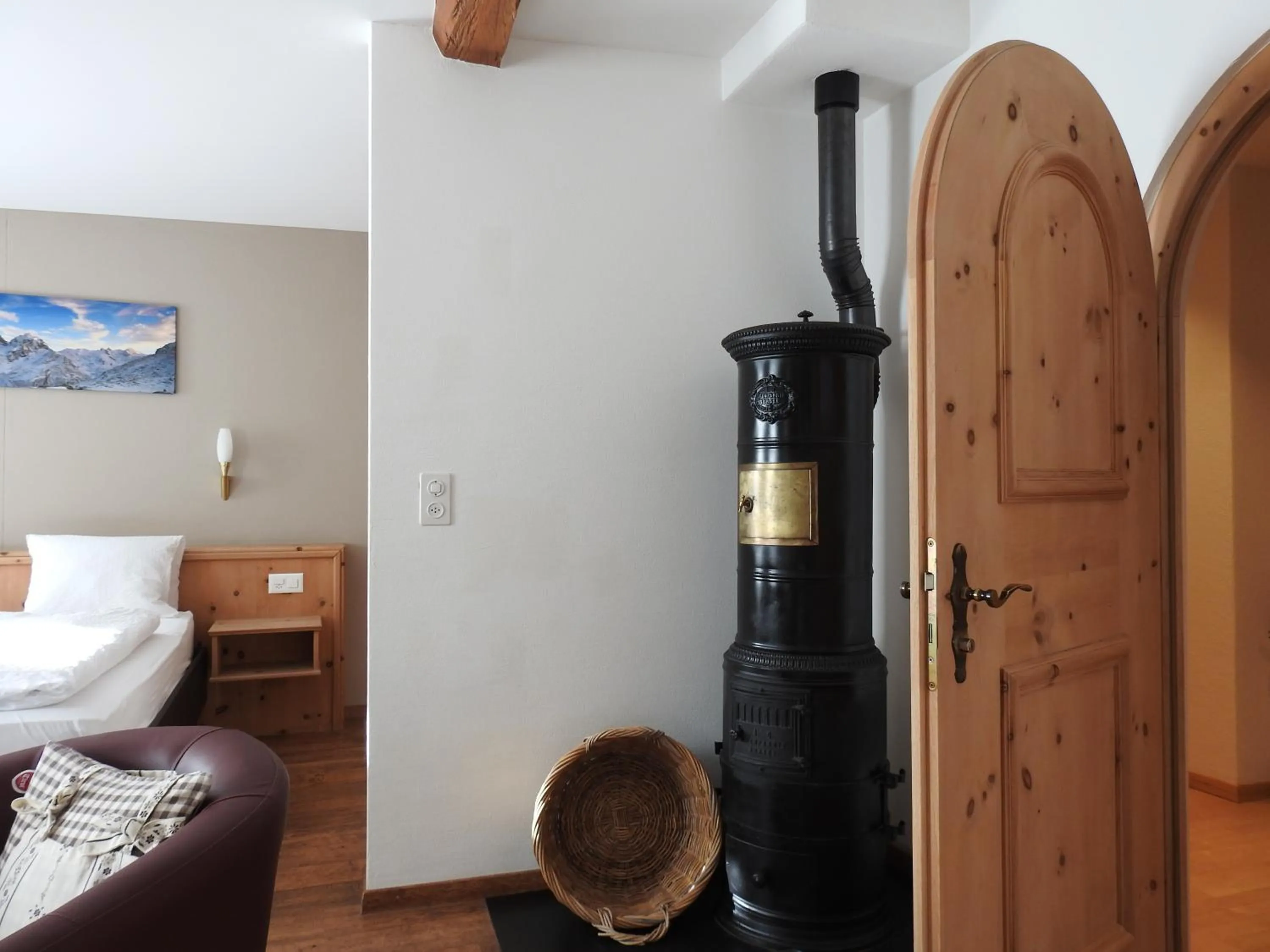 fireplace, Bed in Hotel Spöl Restaurant