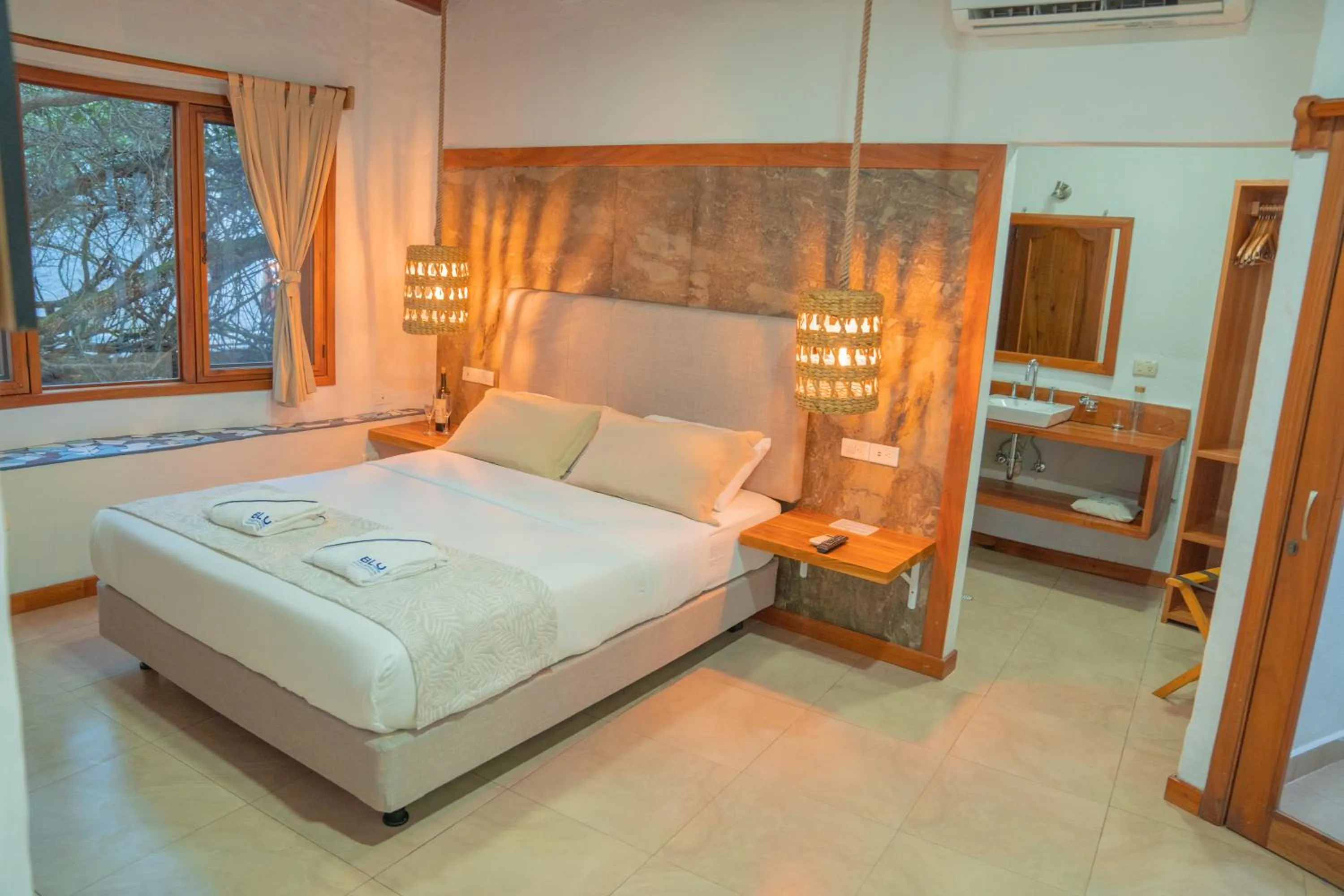 Bed in Blu Galapagos Sustainable Waterfront Lodge