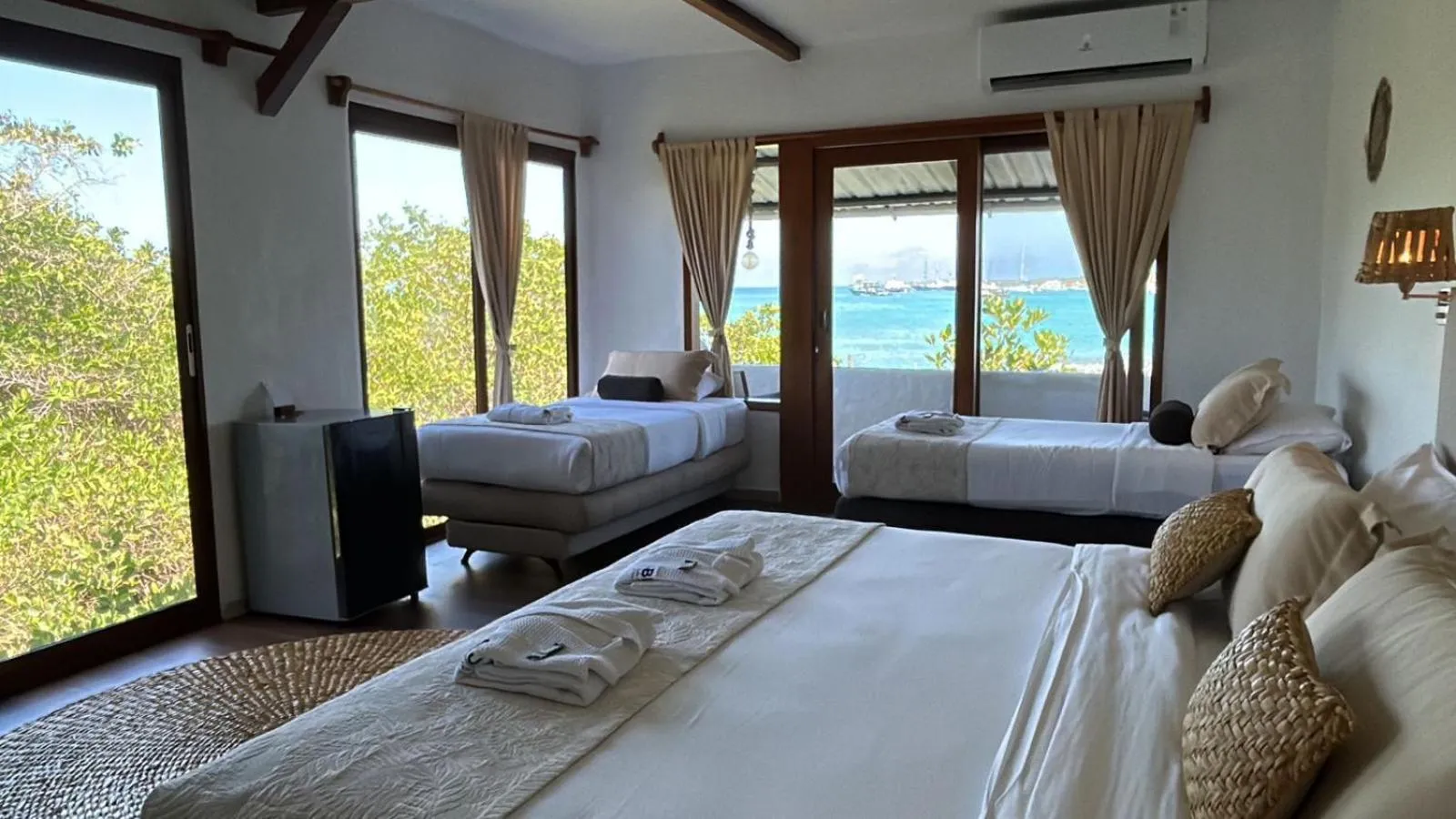 Photo of the whole room, Bed in Blu Galapagos Sustainable Waterfront Lodge