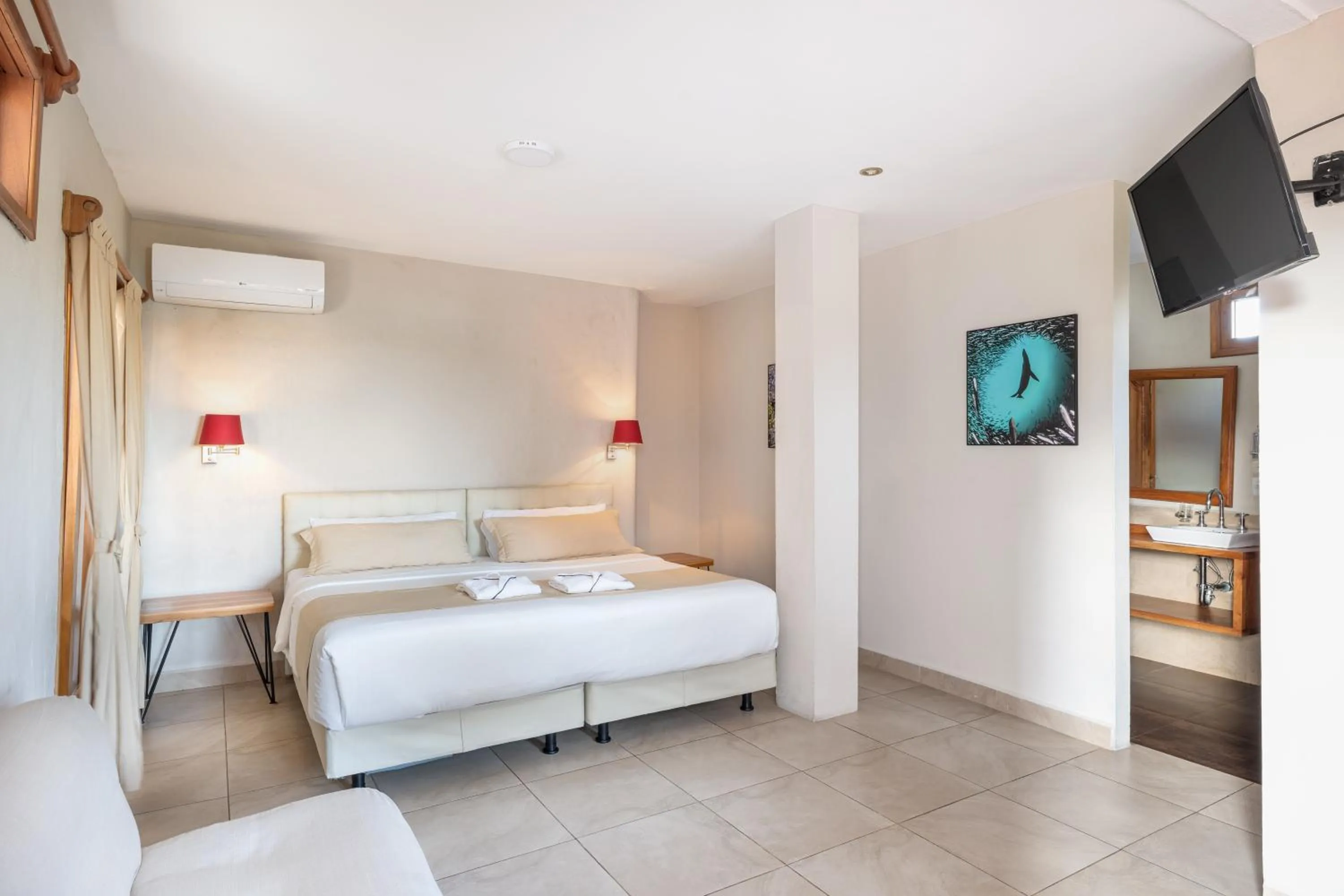 Bed in Blu Galapagos Sustainable Waterfront Lodge