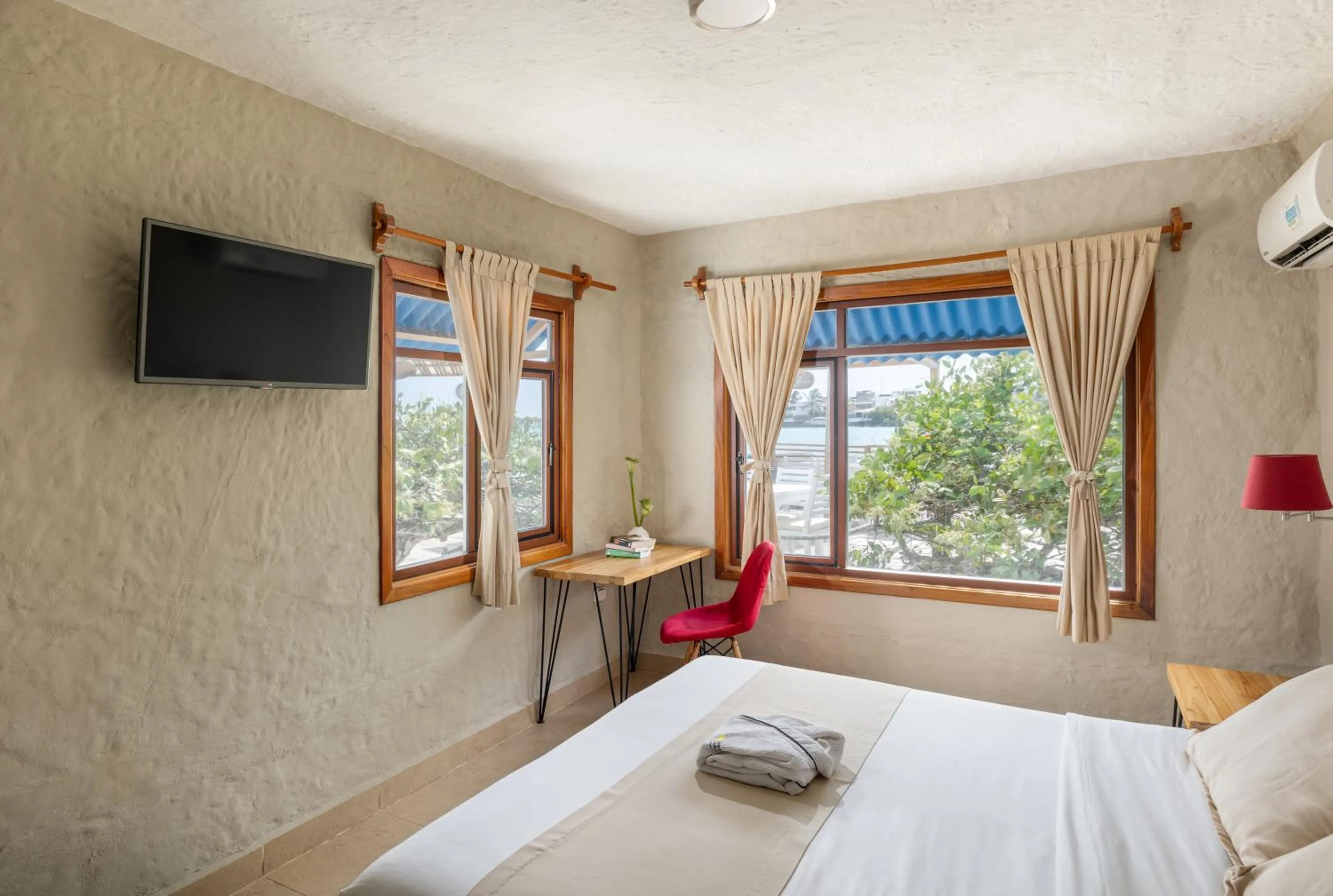 Bed in Blu Galapagos Sustainable Waterfront Lodge