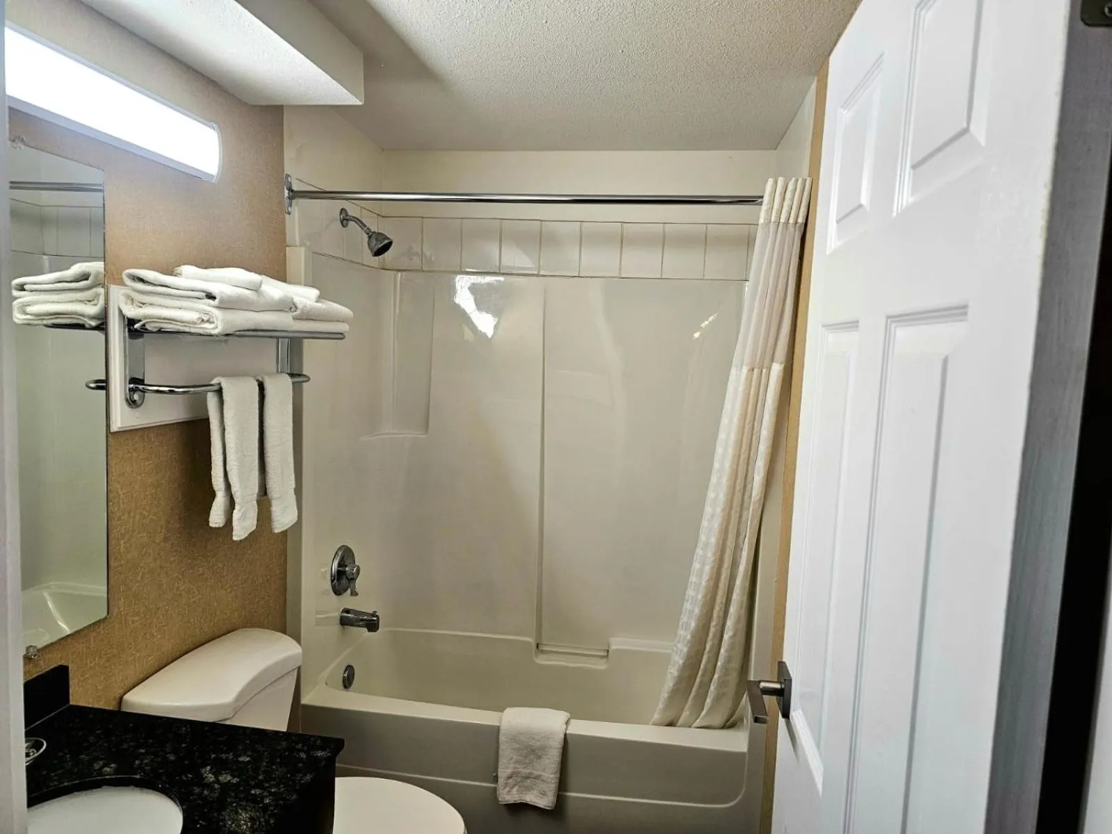 Shower in Rodeway Inn & Suites