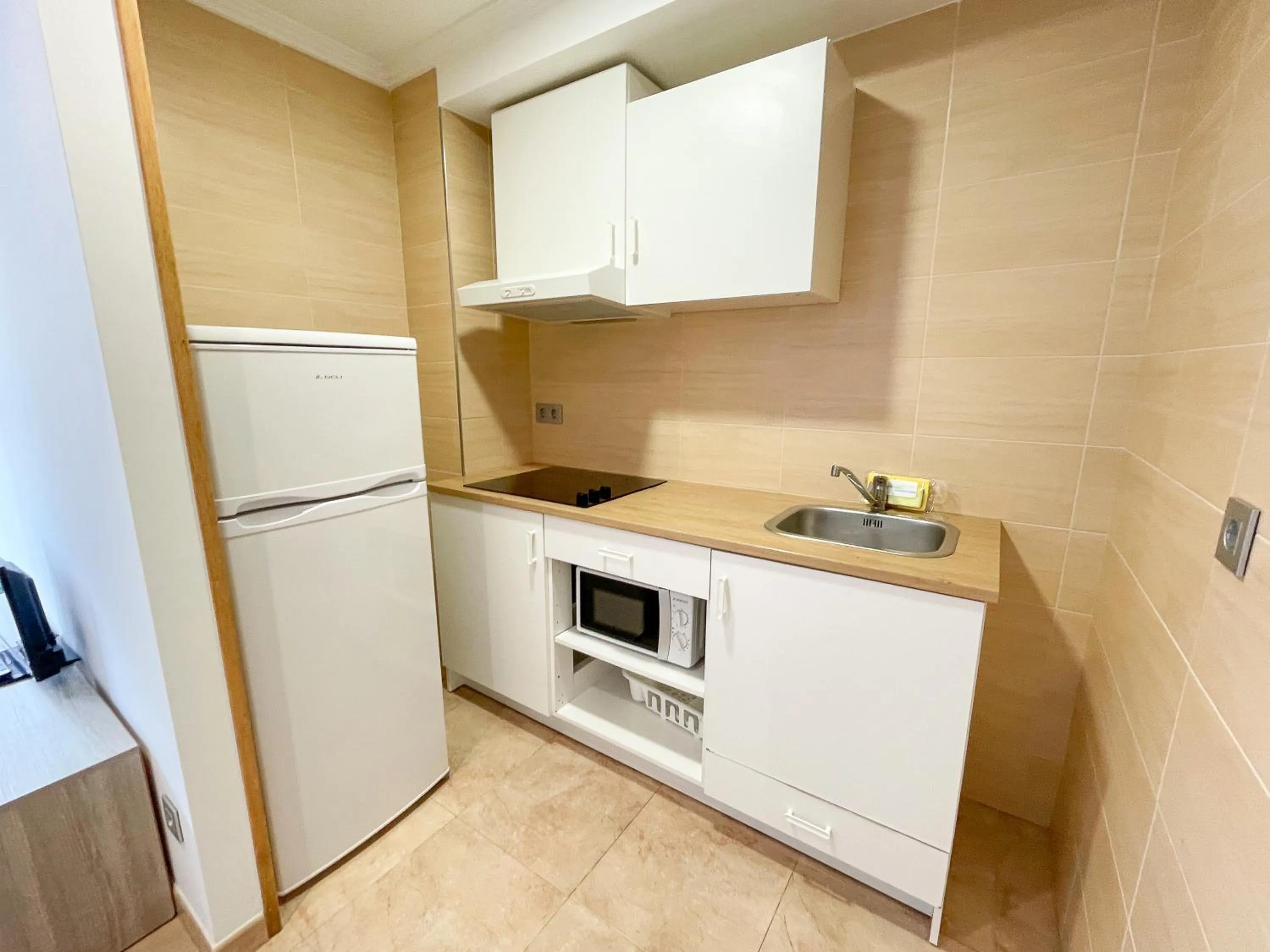 Kitchen or kitchenette in Apartamentos Revolta Sanxenxo 3000