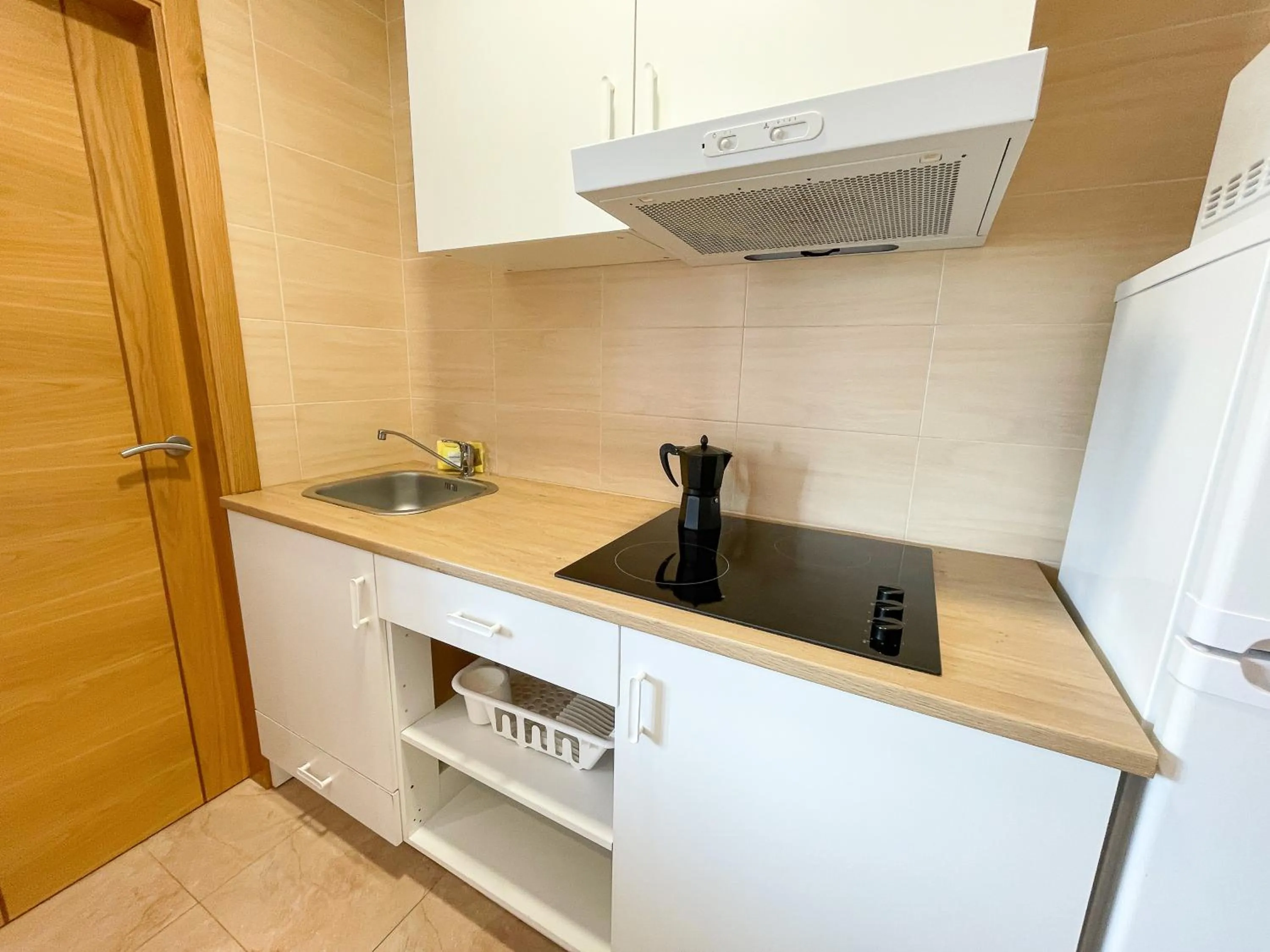Kitchen or kitchenette in Apartamentos Revolta Sanxenxo 3000
