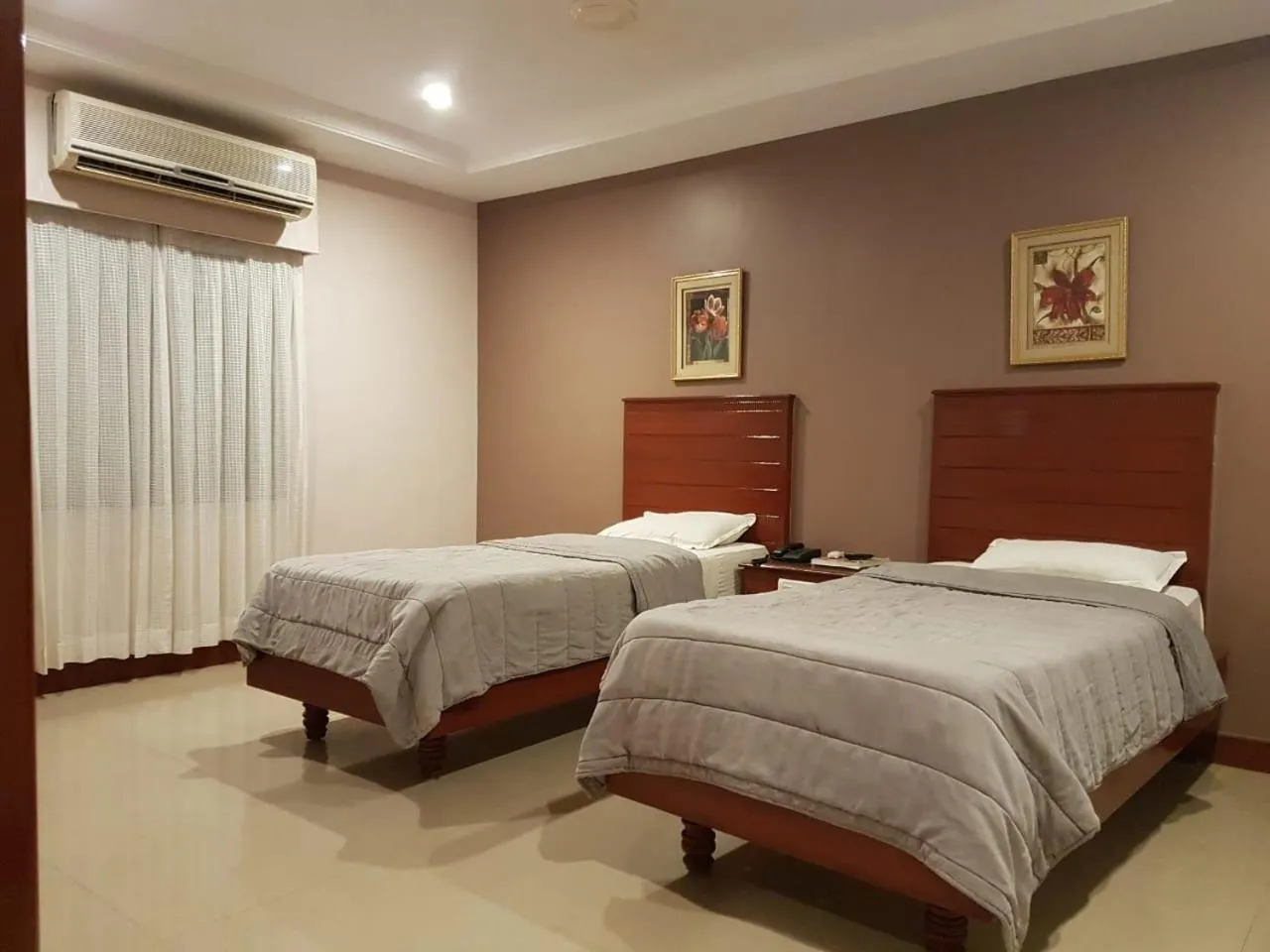 Bed in Hotel Subhalakshmi Palace