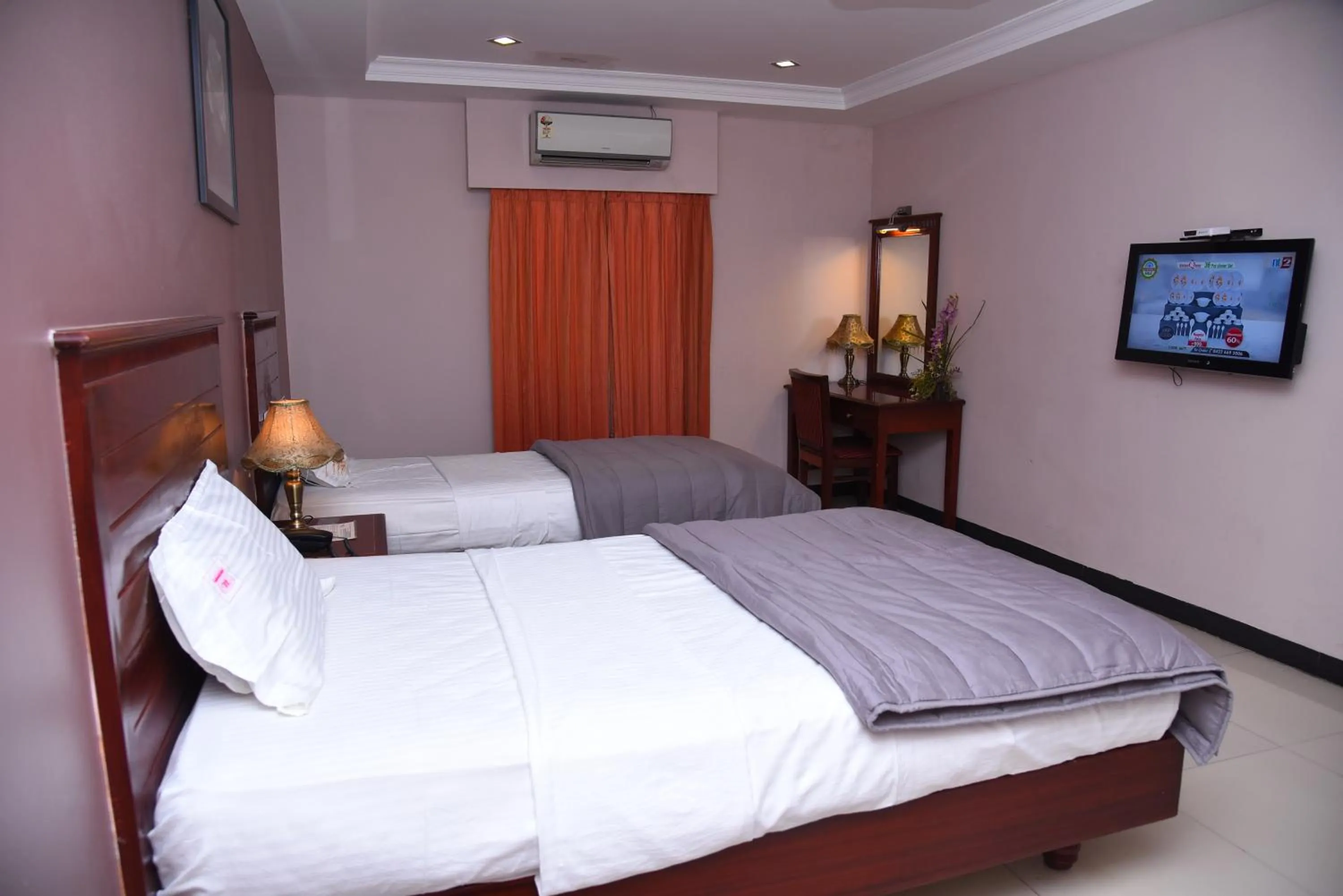 Bed in Hotel Subhalakshmi Palace