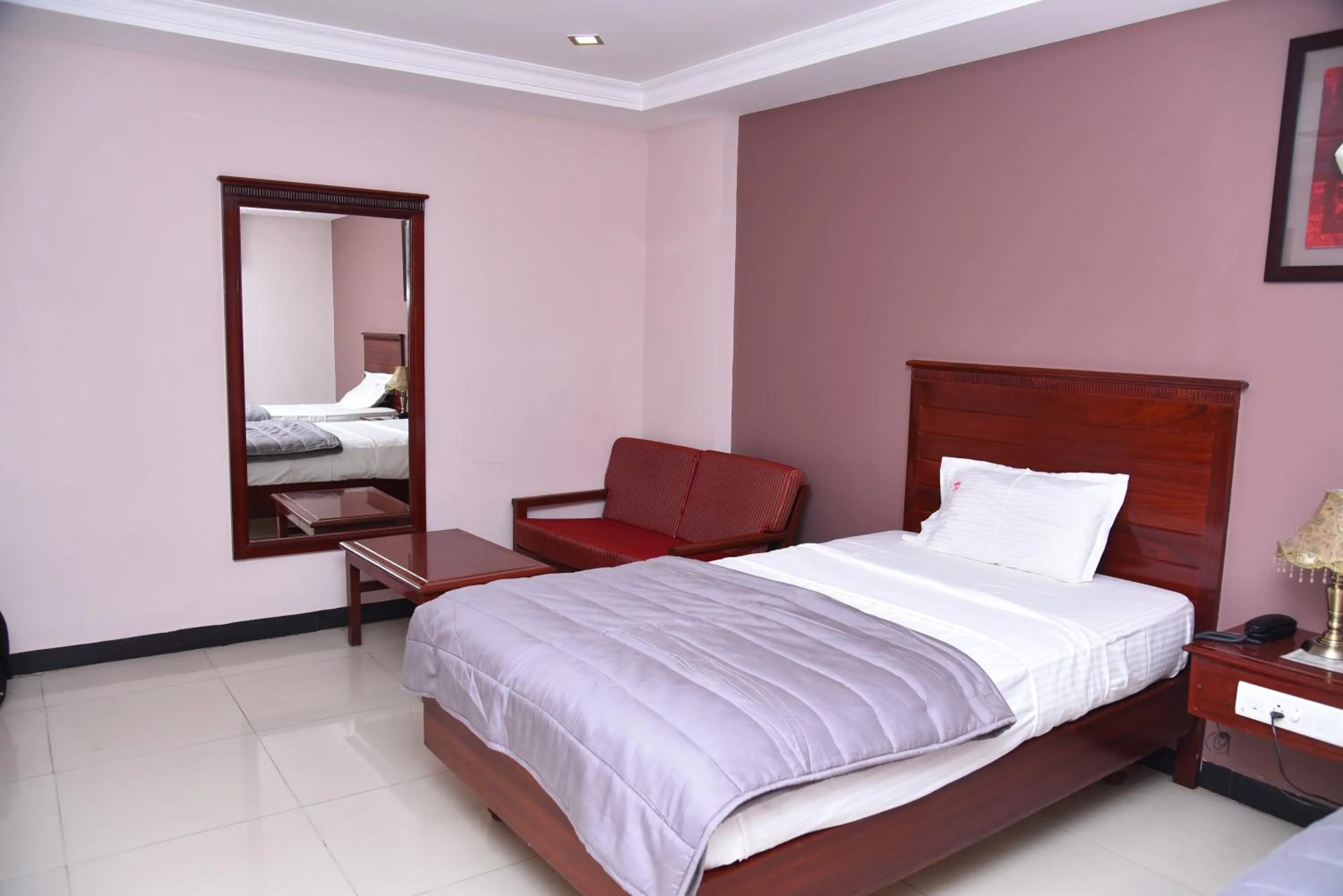 Bed in Hotel Subhalakshmi Palace