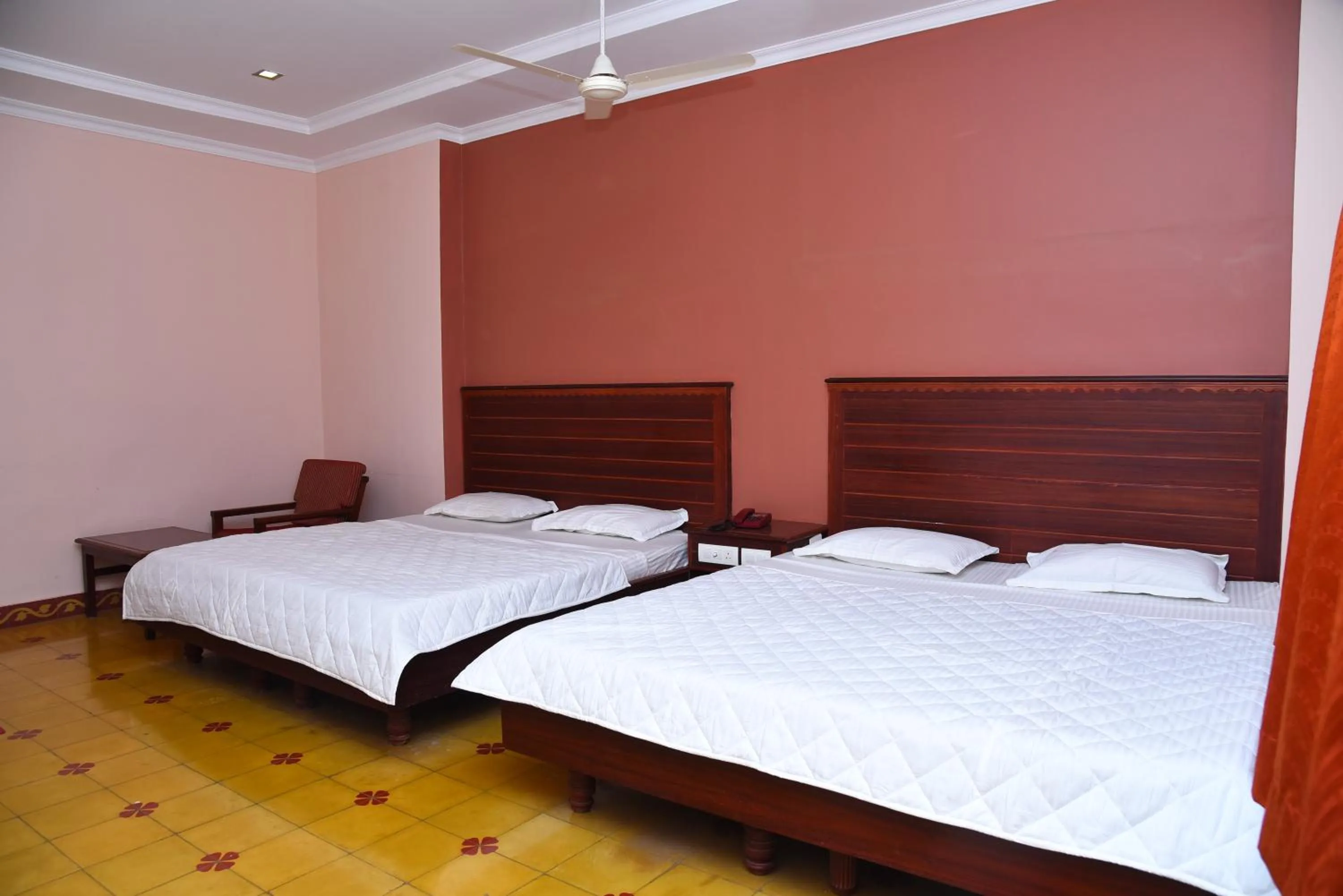 Bed in Hotel Subhalakshmi Palace