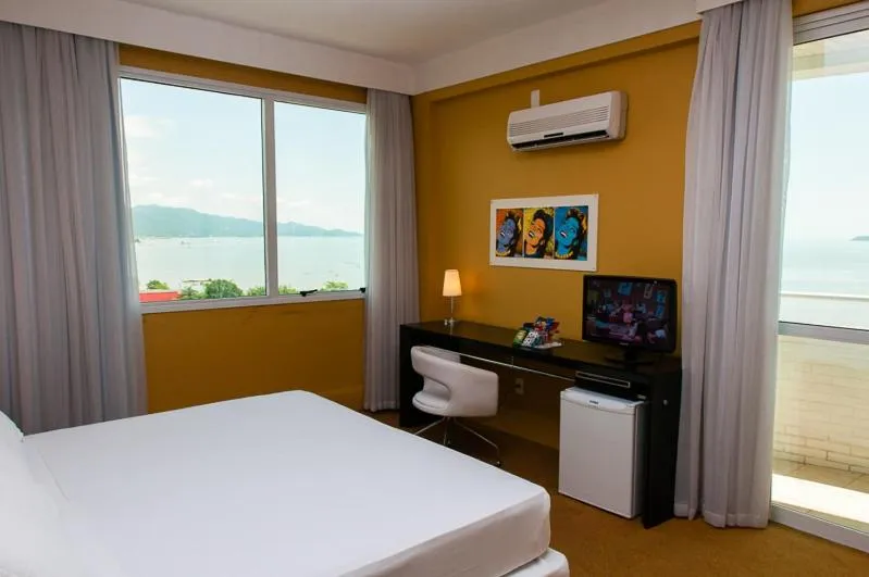 Photo of the whole room, Bed in Favorita Golden Hotel e Eventos