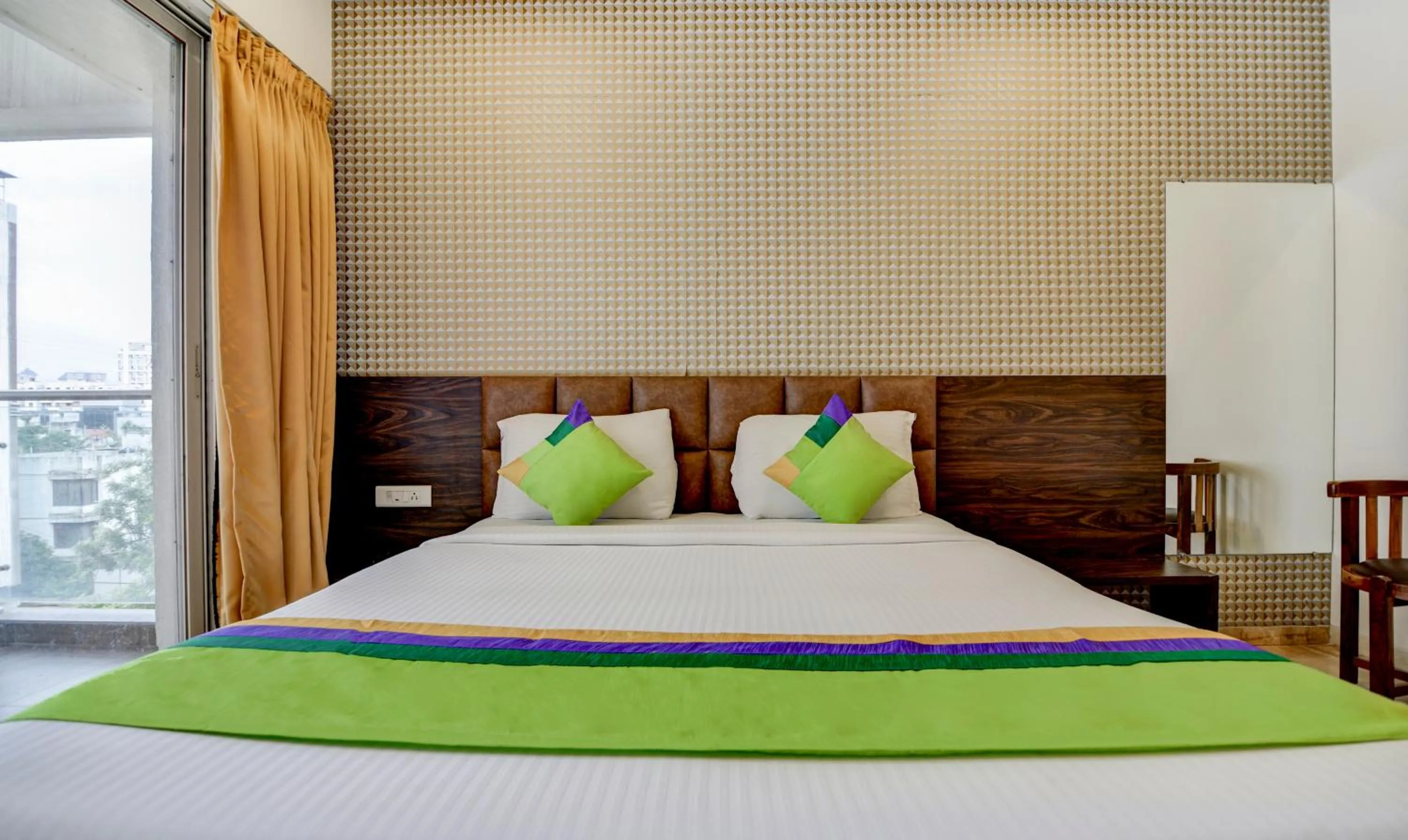 Bed in Treebo Kuval Inn