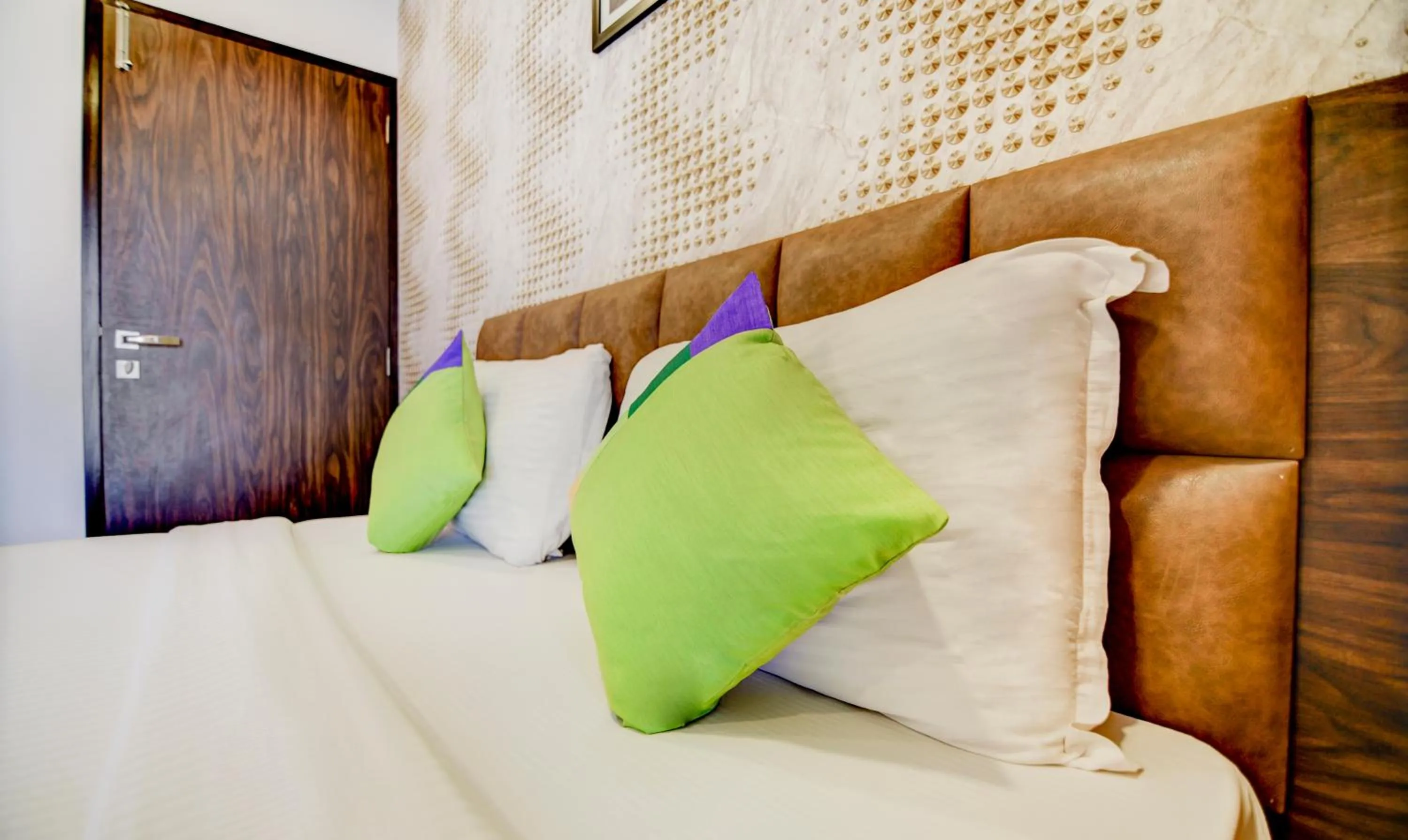 Bed in Treebo Kuval Inn