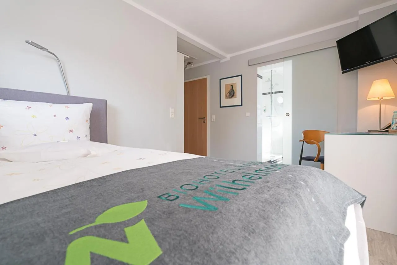 Photo of the whole room, Bed in BioHotel Kassel Wilhelmshöher Tor