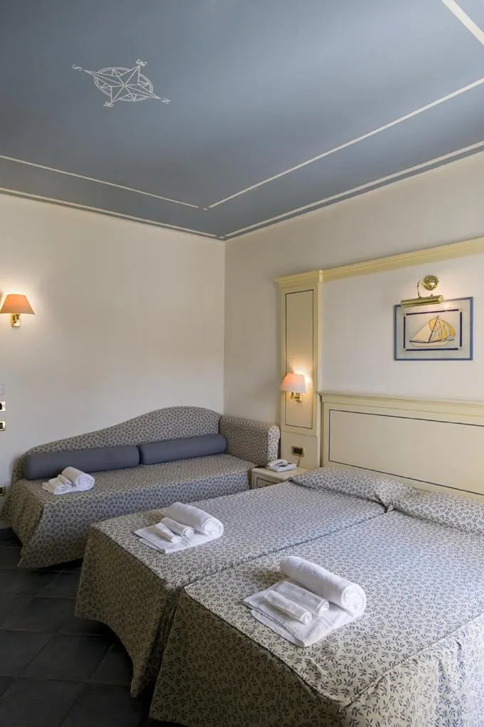 Bed in Hotel Poseidon