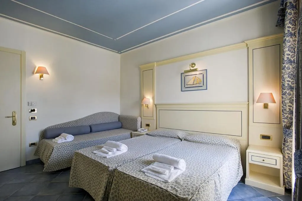 Bed in Hotel Poseidon