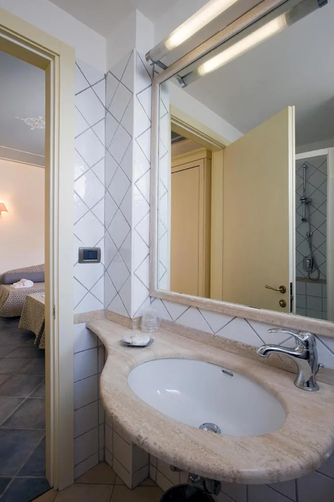 Bathroom, Bed in Hotel Poseidon