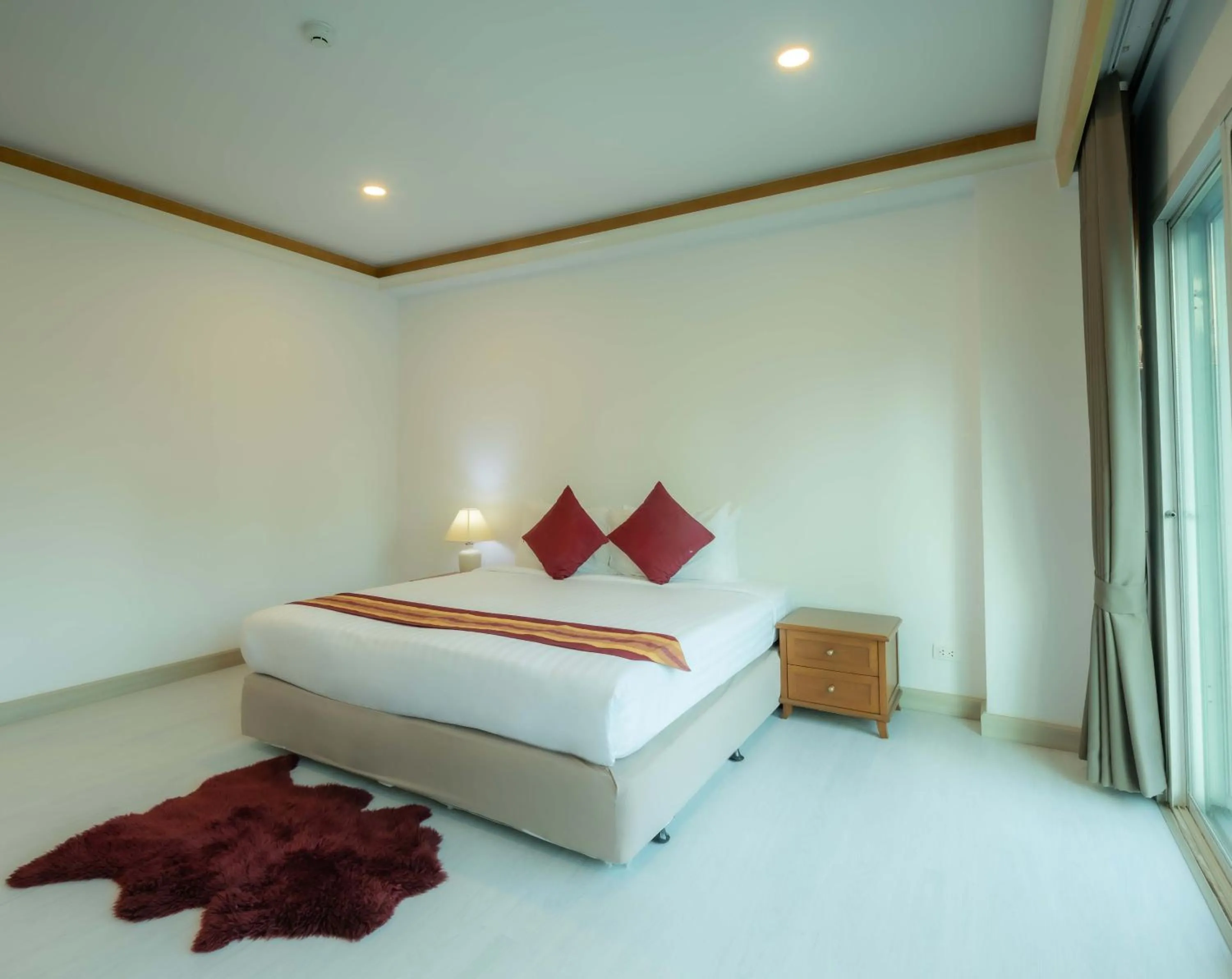 Bed in Chaidee Mansion