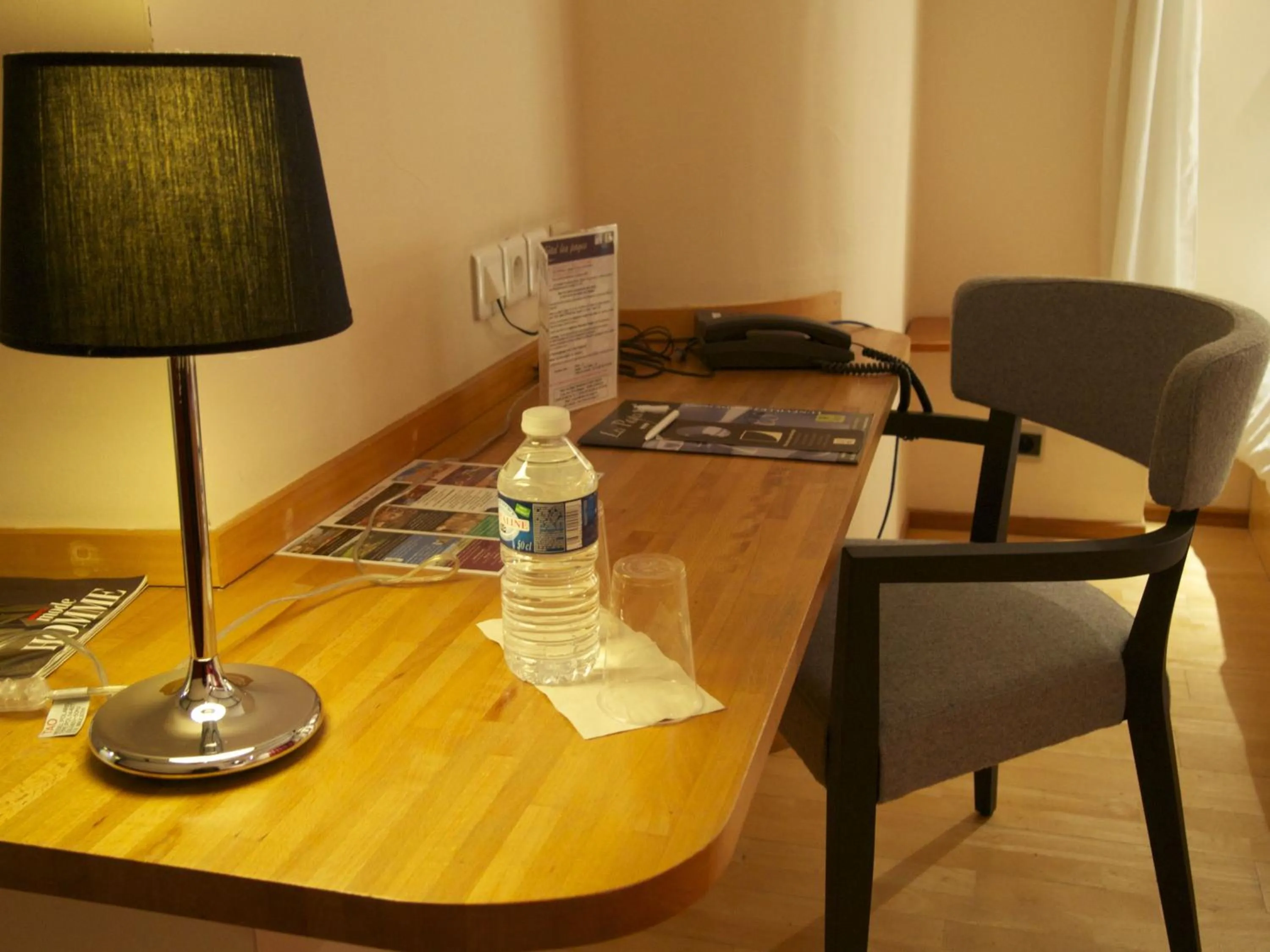 Seating area in Logis Hôtel Les Pages