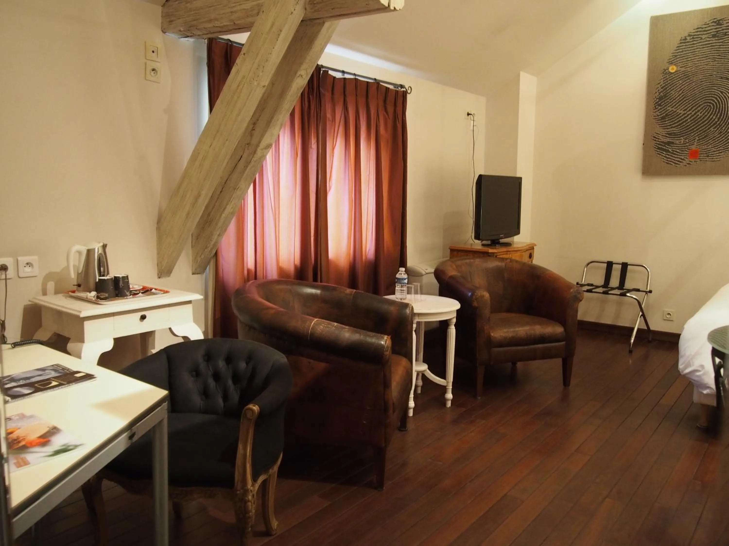 Photo of the whole room in Logis Hôtel Les Pages