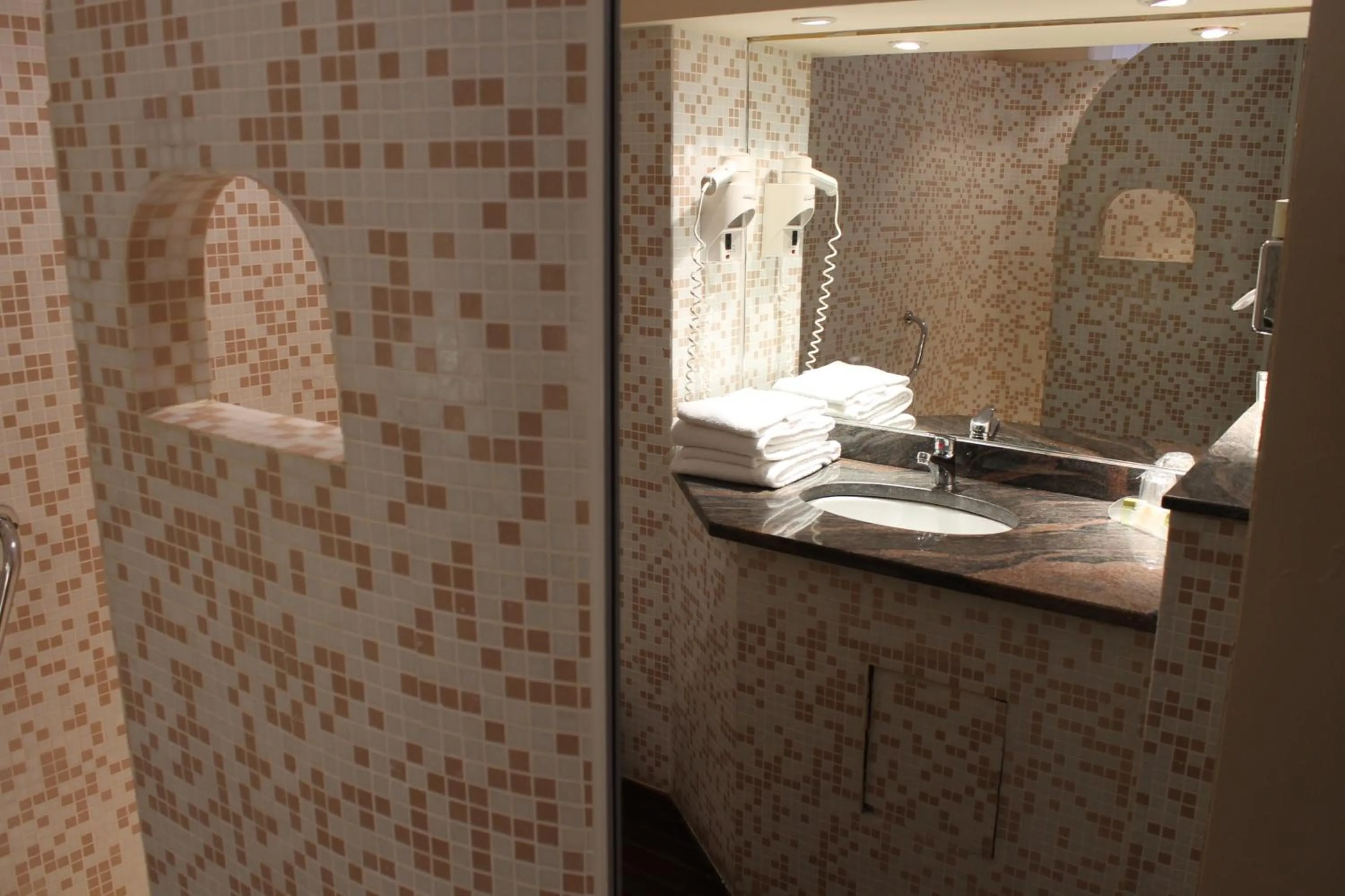 Bathroom in Logis Hôtel Les Pages