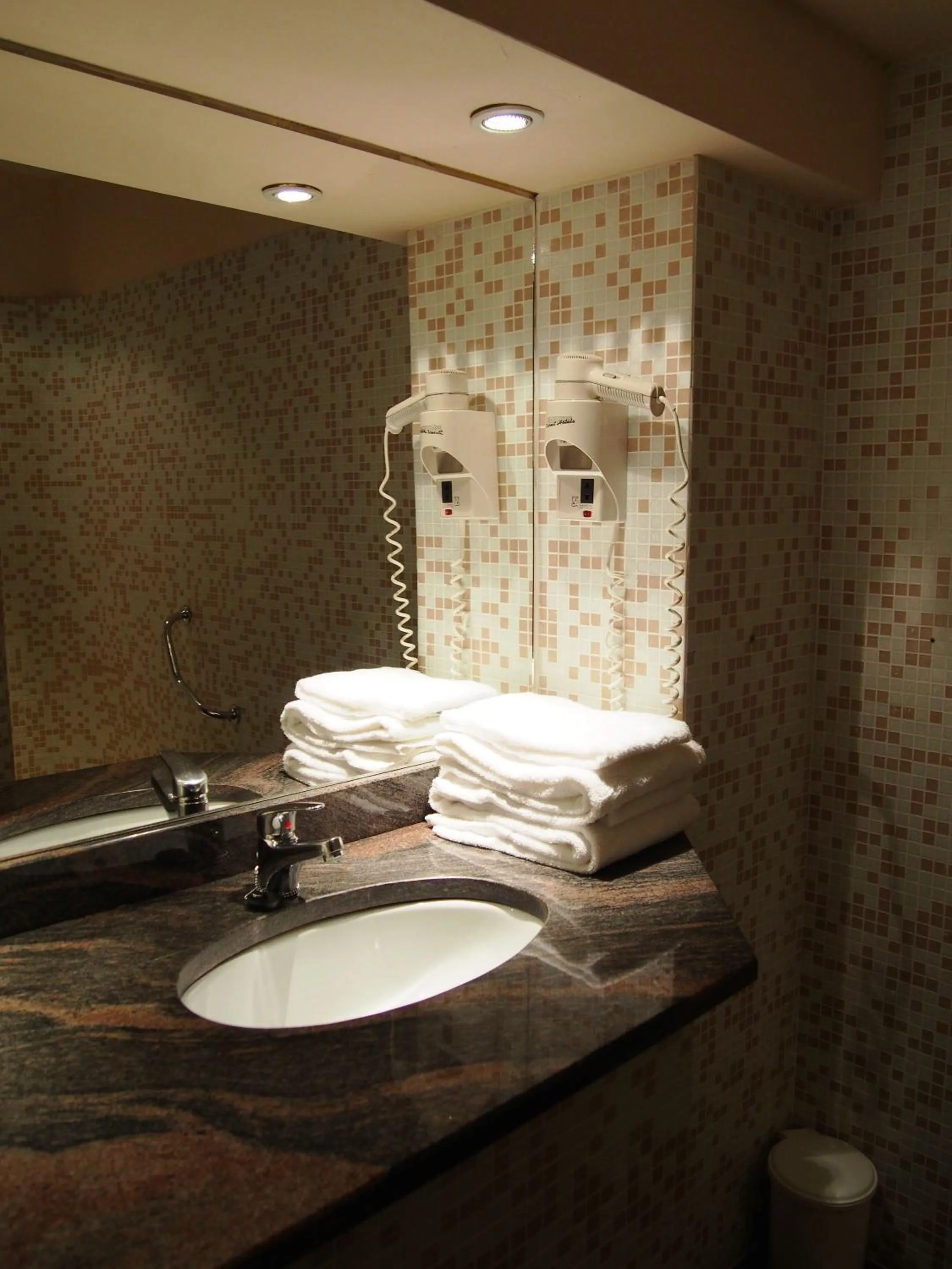 Bathroom in Logis Hôtel Les Pages