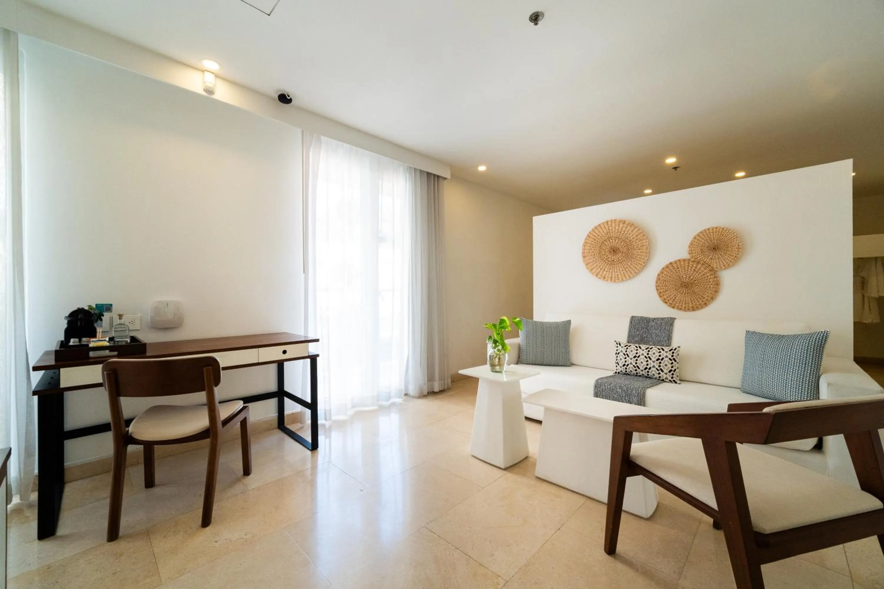 Seating area in Nacar Hotel Cartagena, Curio Collection by Hilton