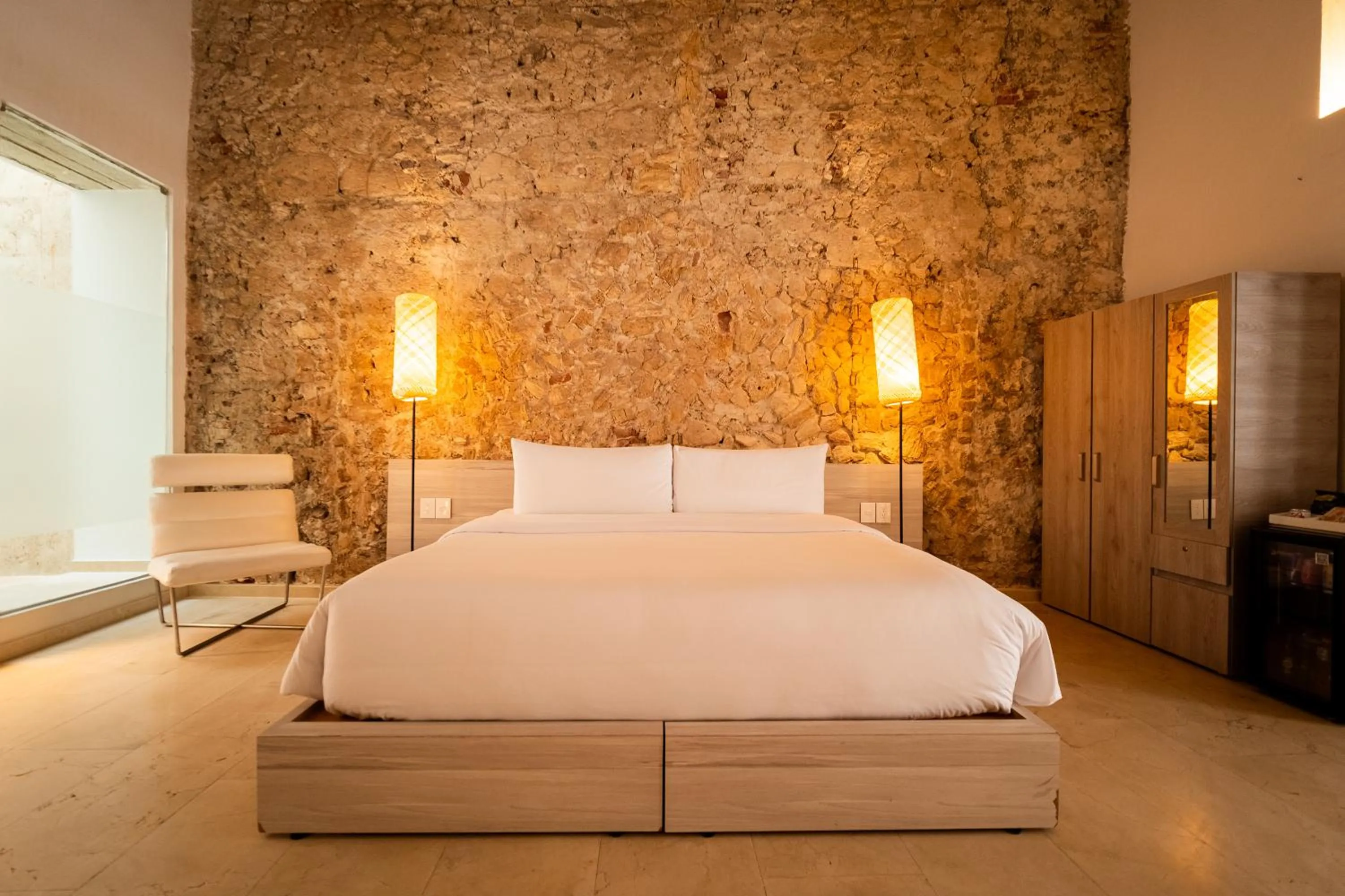 Bedroom, Bed in Nacar Hotel Cartagena, Curio Collection by Hilton