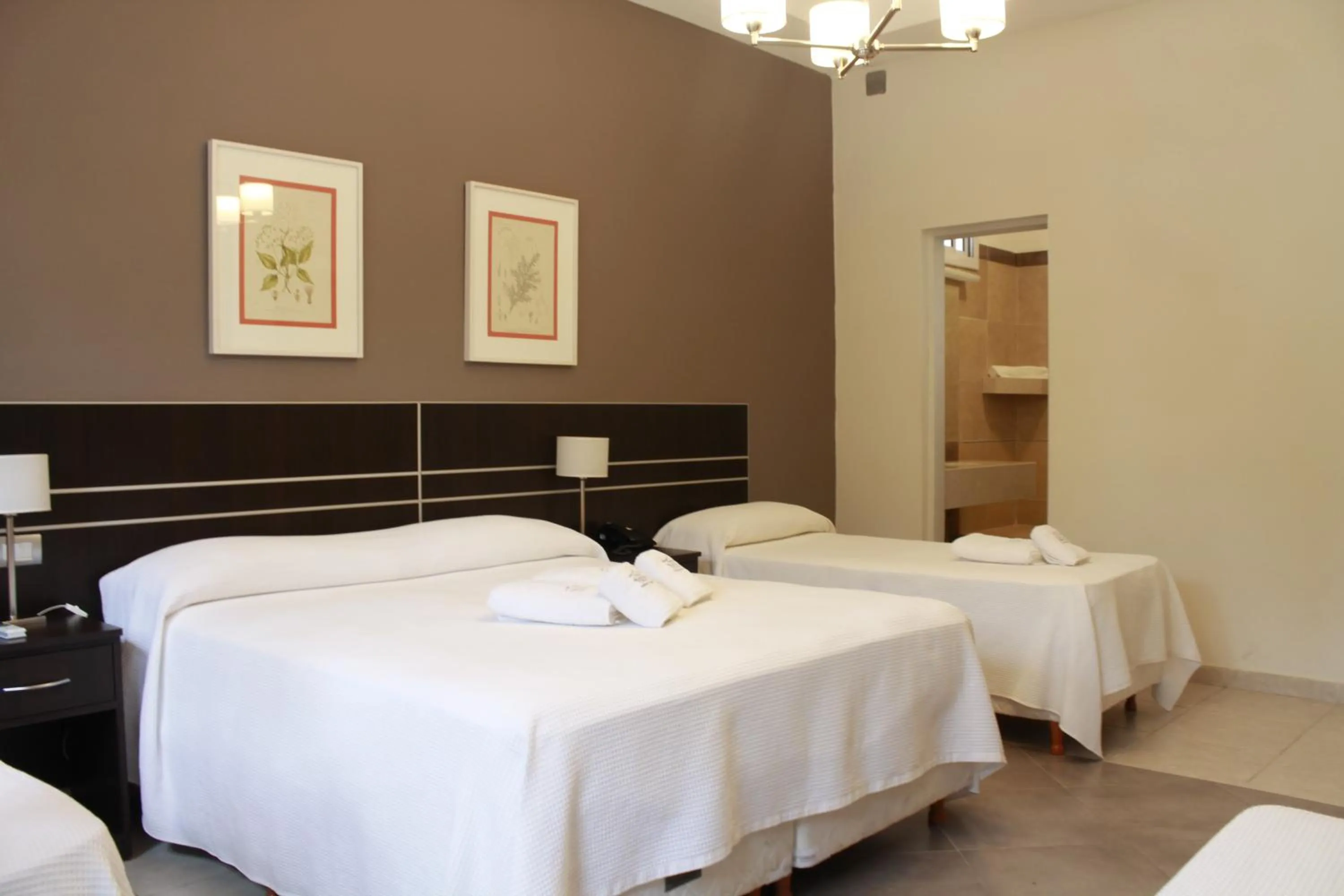 Bed in Hostería Atahualpa Yupanqui