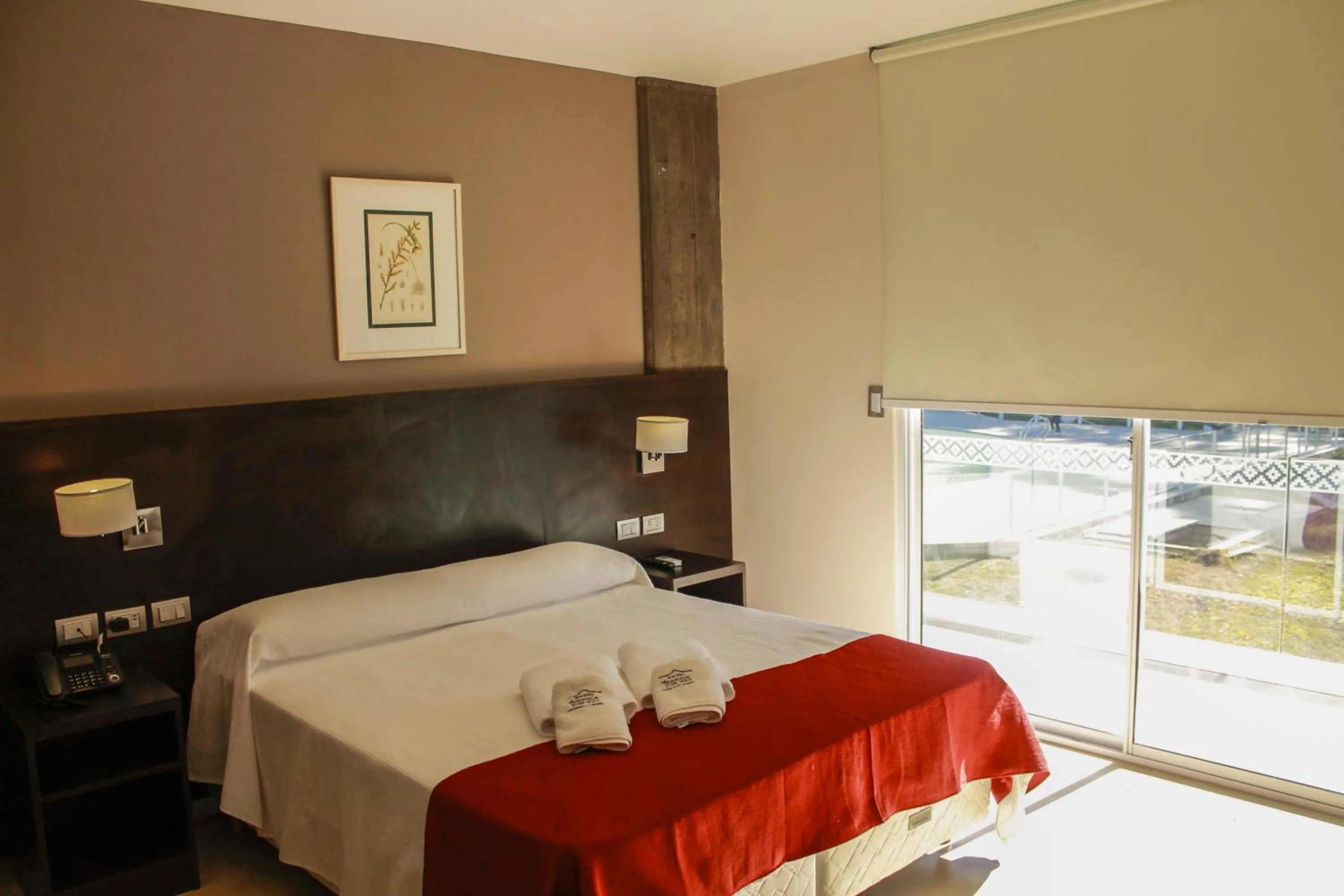 Bed in Hostería Atahualpa Yupanqui